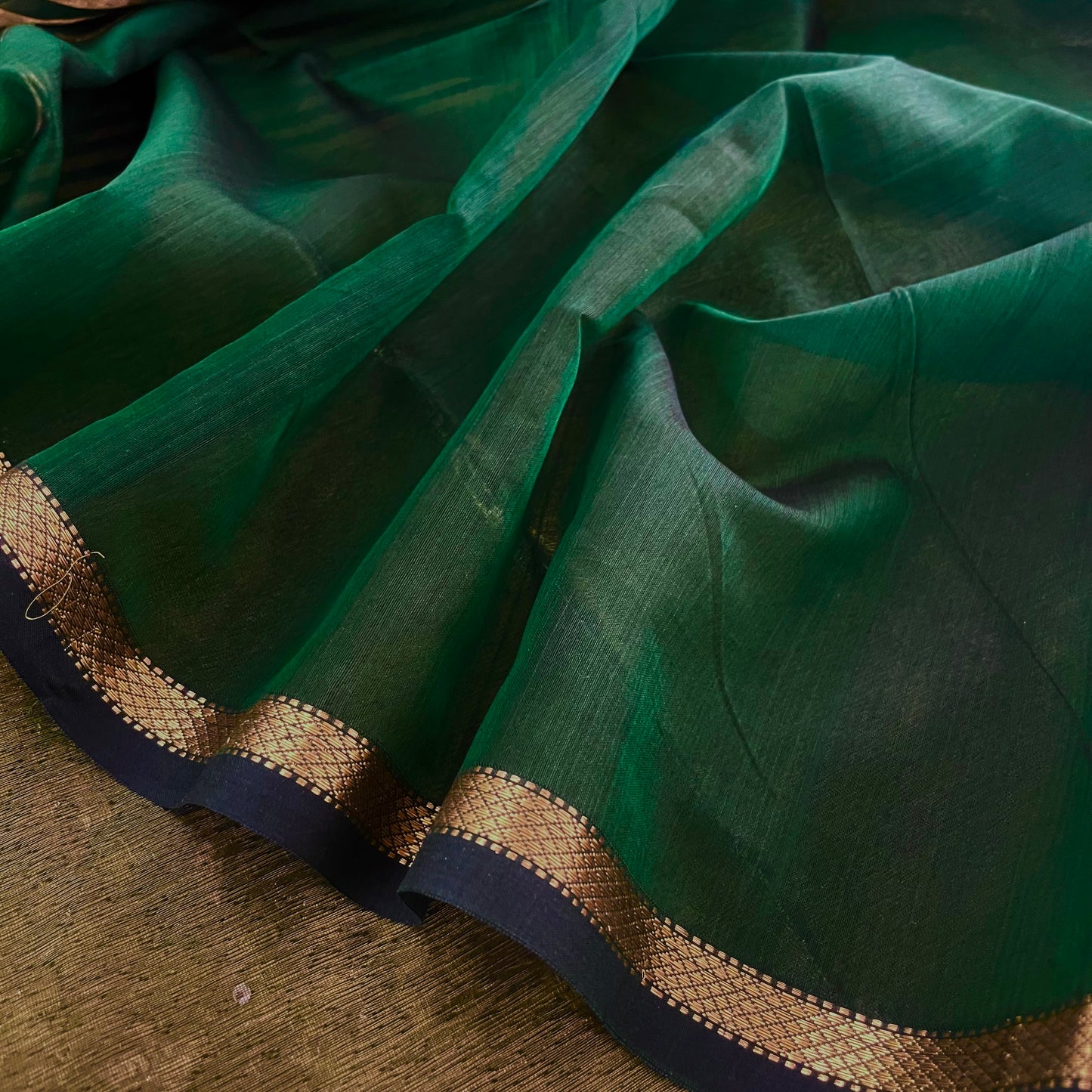 Dark green Maheshwari saree with zari stripes all over