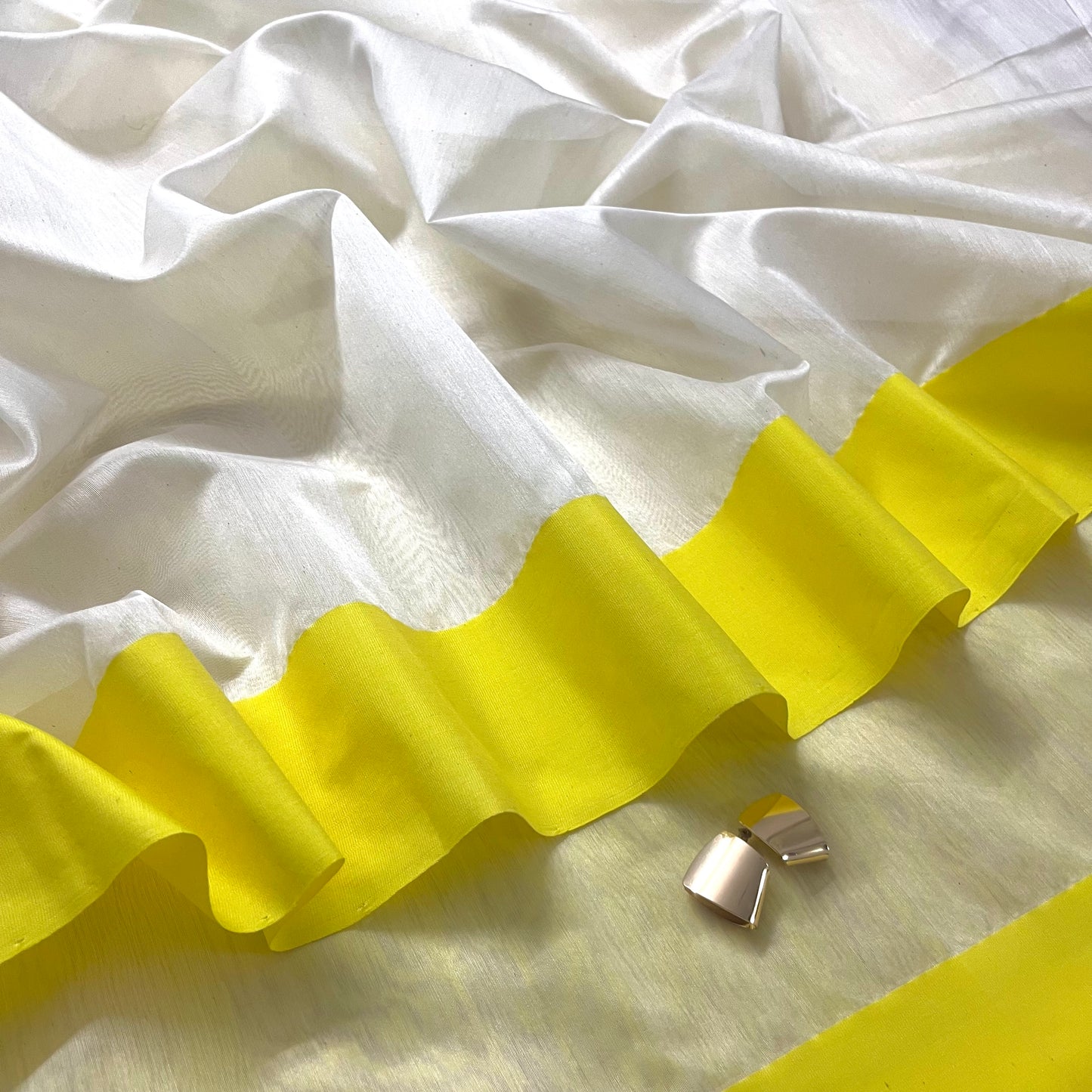 White and lemon Chanderi saree with zari lines on pallu