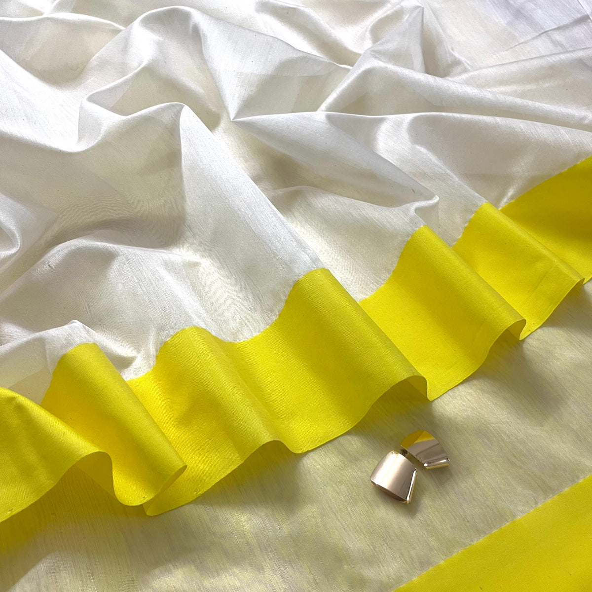 White and lemon Chanderi saree with zari lines on pallu