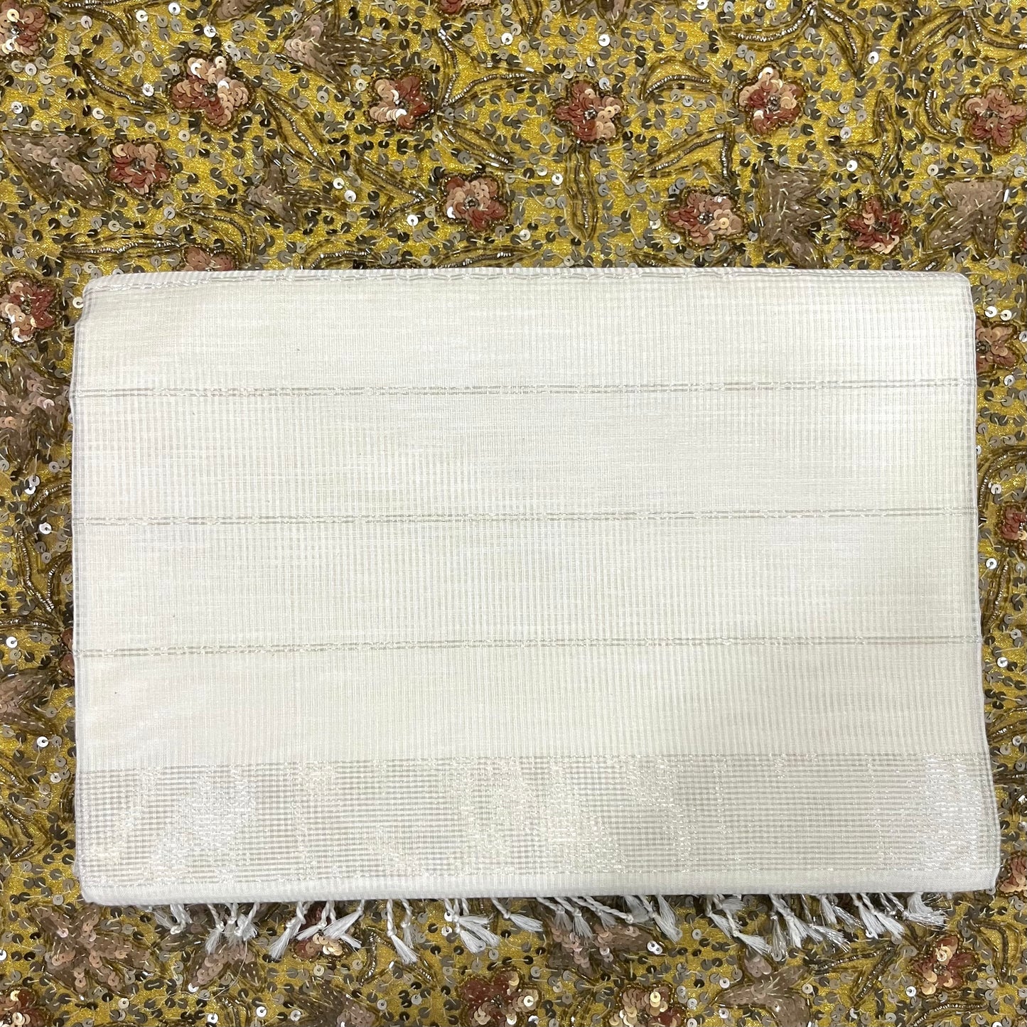 White Maheshwari saree with zari border and zari lines on pallu