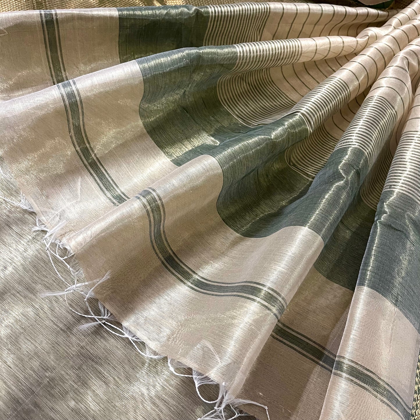 Gold and green Maheshwari tissue silk saree with zari pattern on pallu