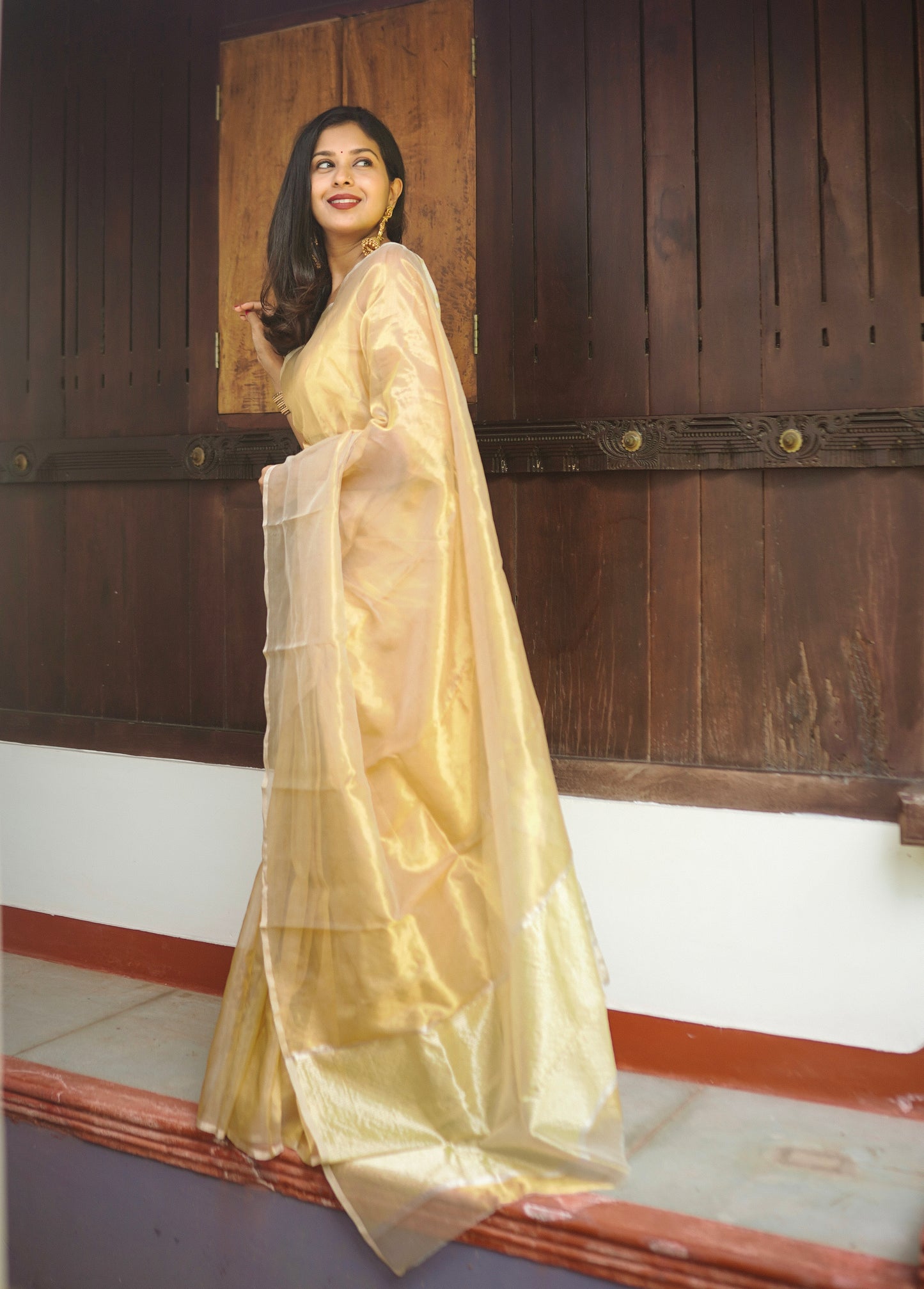 Molten gold chanderi tissue silk saree with zari lines on pallu