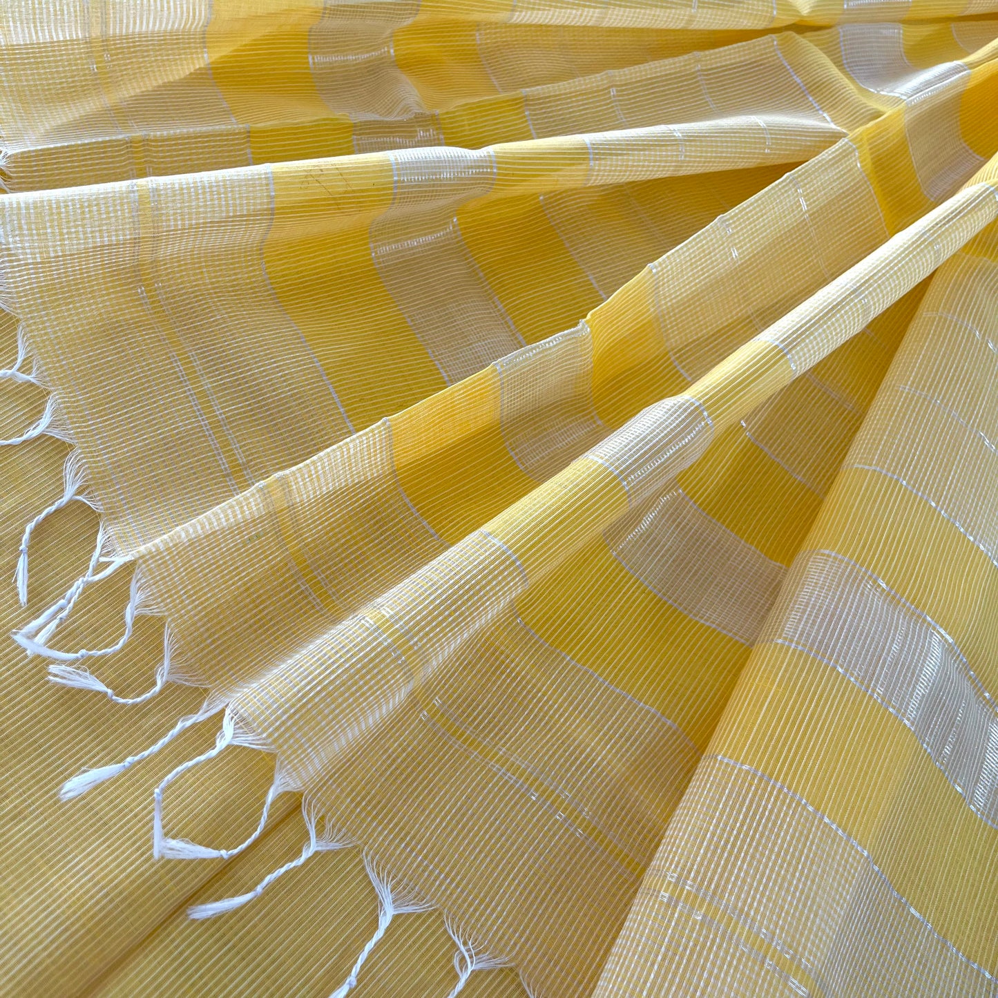 Yellow Maheshwari saree with silver zari border
