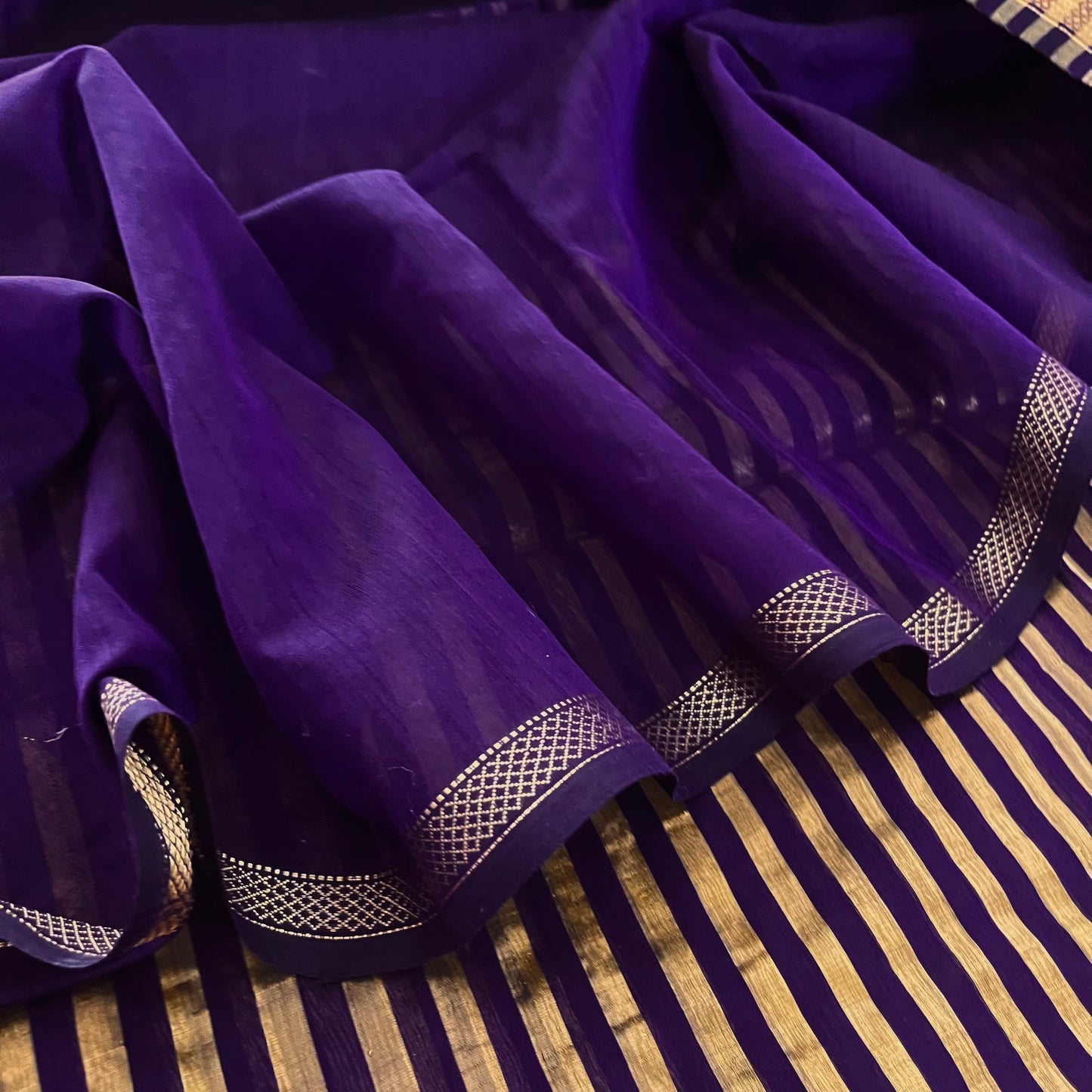 Dark purple and gold Maheshwari saree with zari stripes all over
