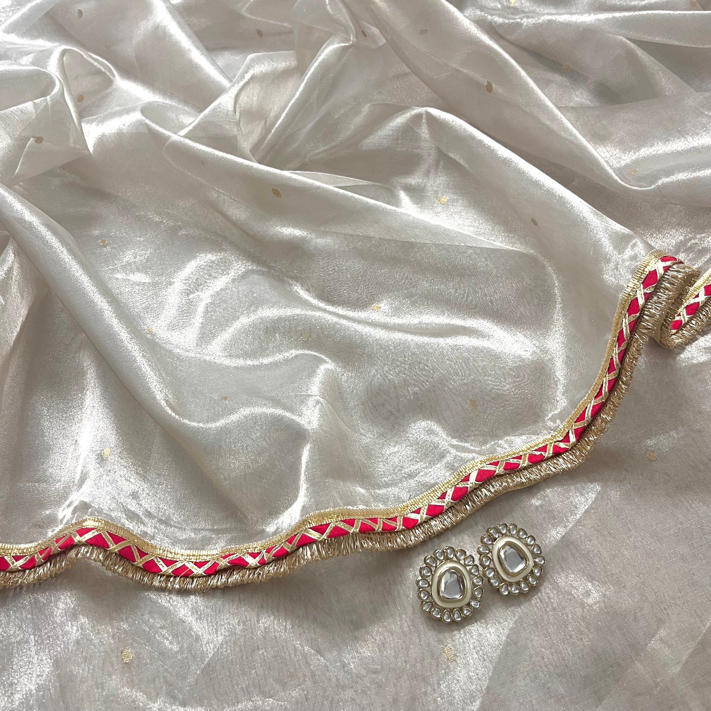 Off white and red Chanderi tissue silk saree with zari bootis all over