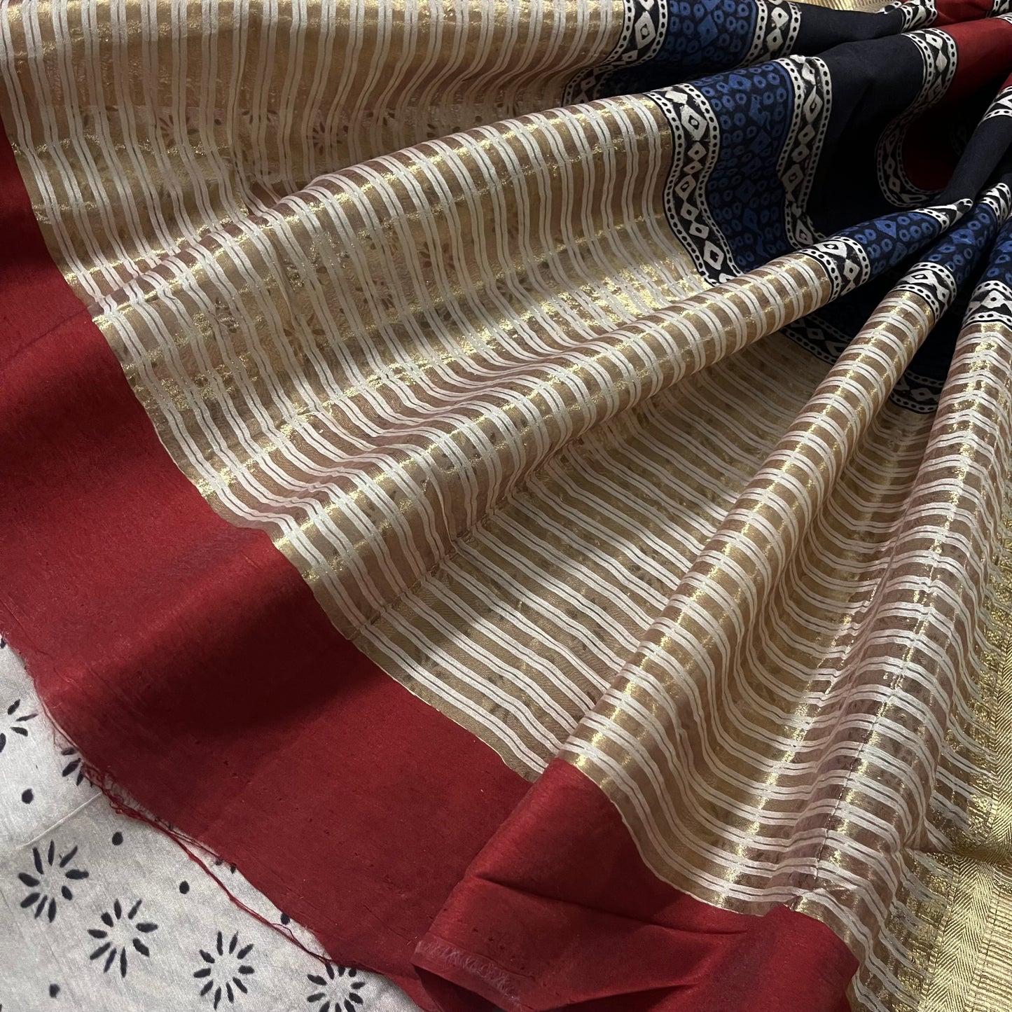 Black and white silk saree with block print all over and zari border