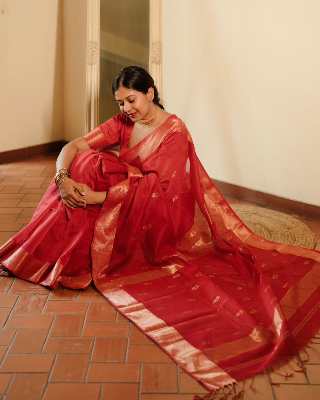Red Maheshwari saree with morni motifs all over
