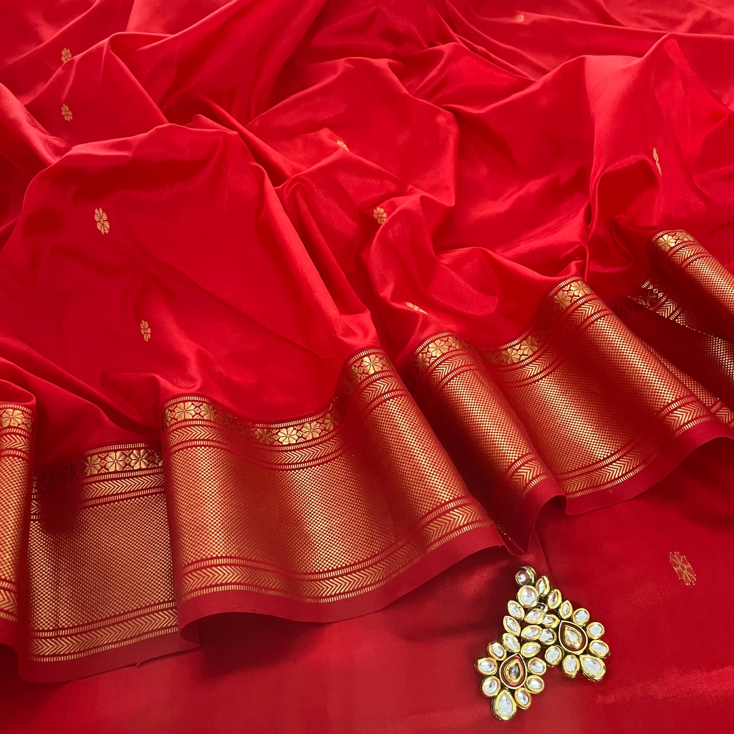 Deep Red Maheshwari silk saree with flower bootis all over