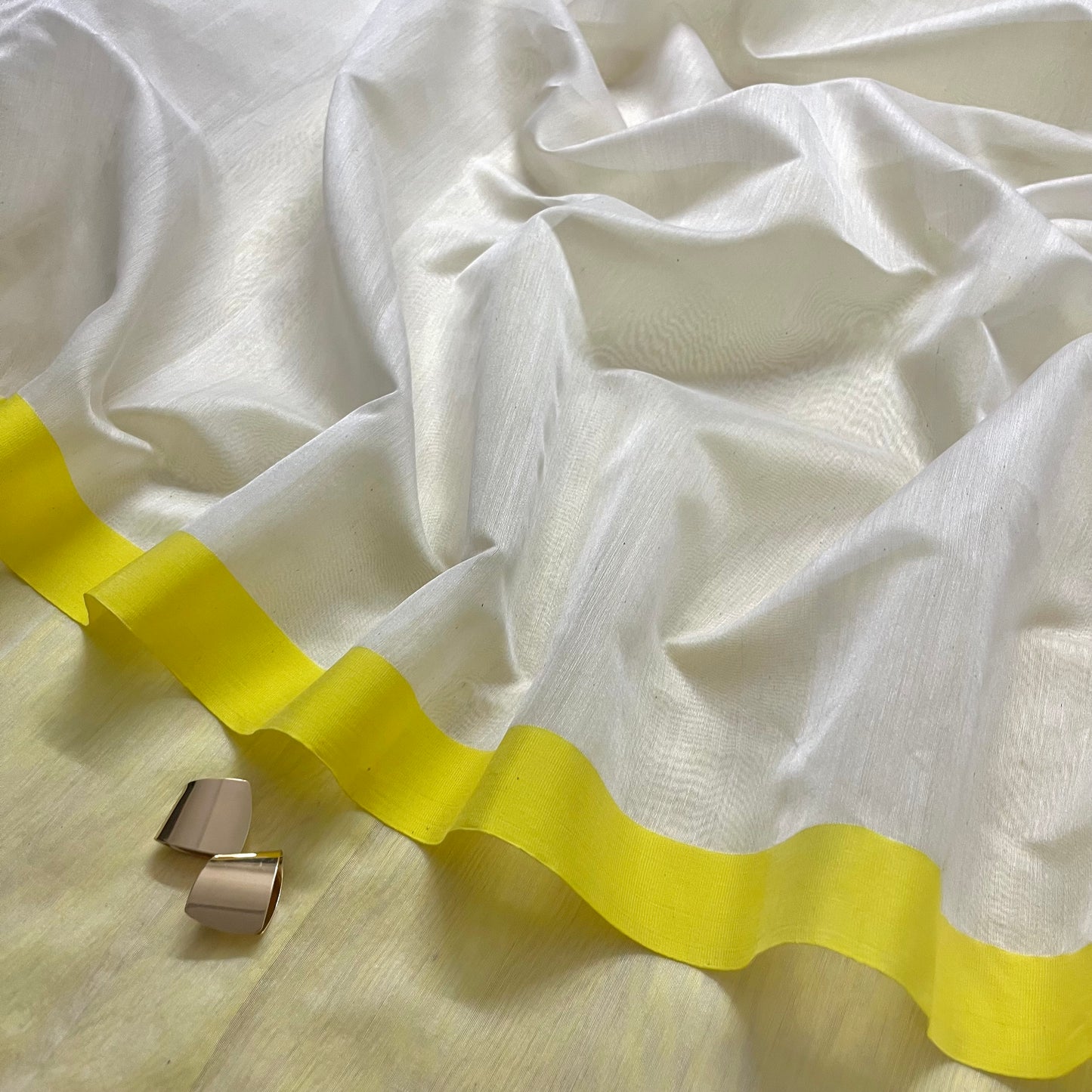 White and lemon Chanderi saree with zari lines on pallu