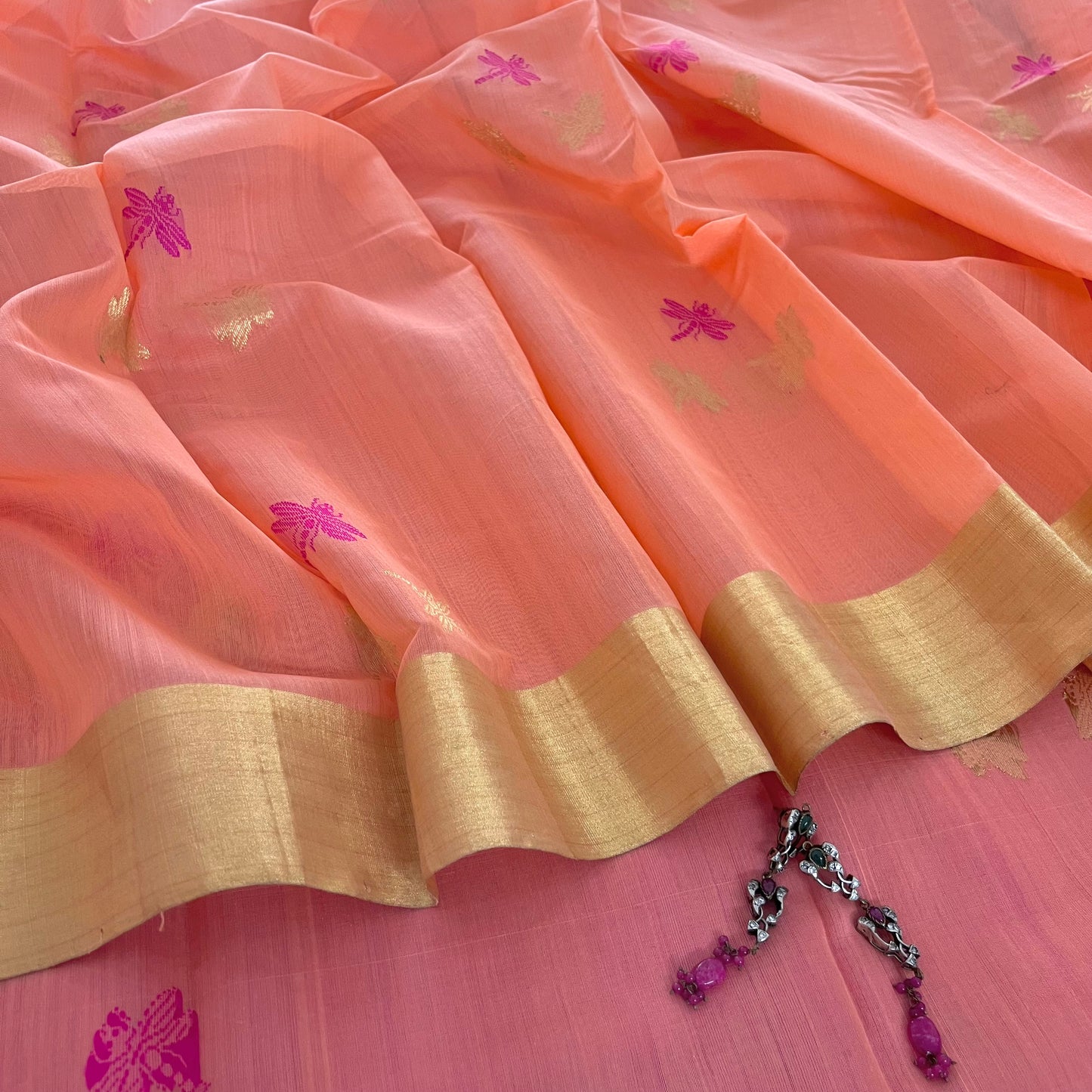 Peachish pink Chanderi silk saree with dragonfly motifs all over