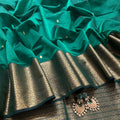 Dark green Maheshwari saree with zari pattern on pallu