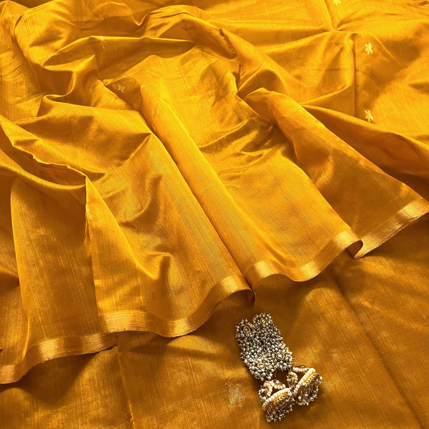 Mustard gold chanderi silk saree with flower bootis all over