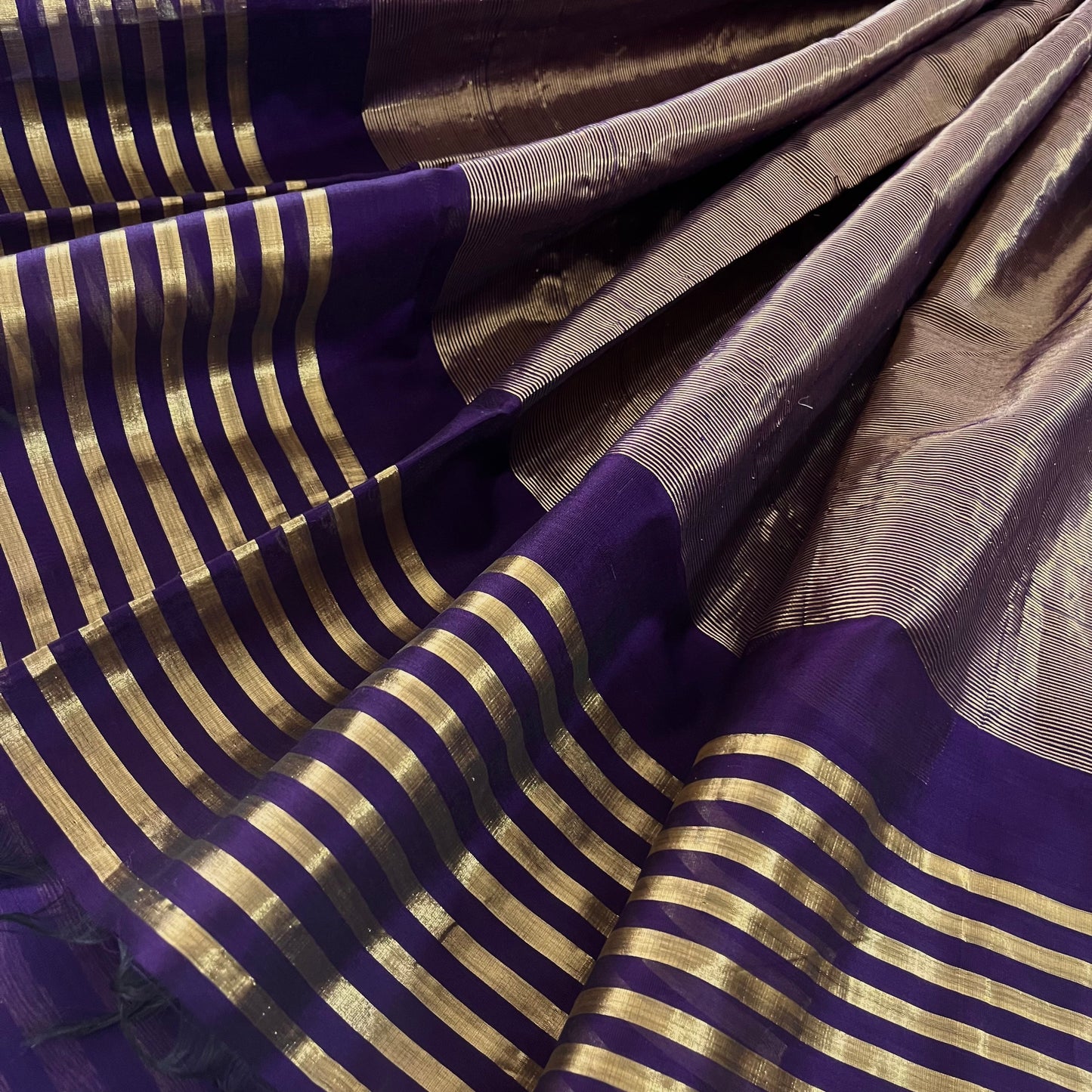 Dark purple and gold Maheshwari saree with zari stripes all over