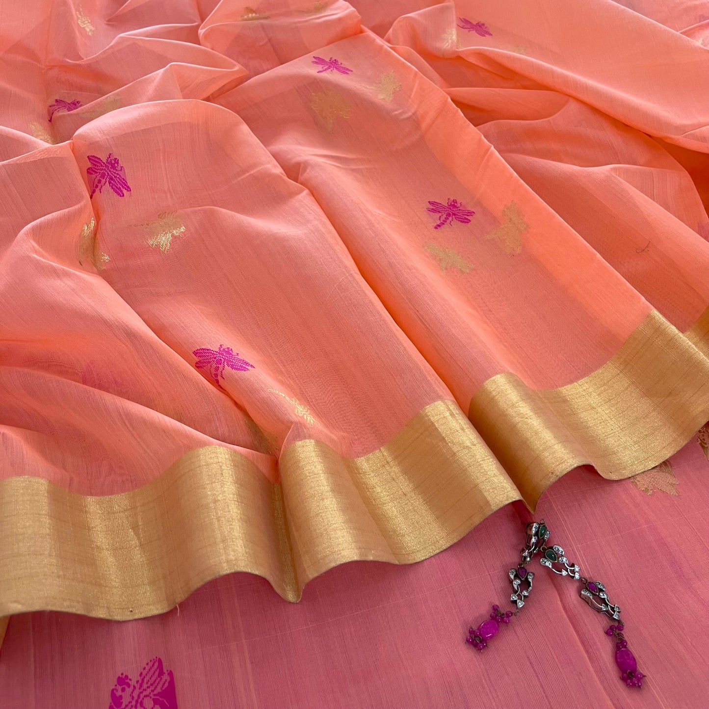 Peachish pink Chanderi silk saree with dragonfly motifs all over