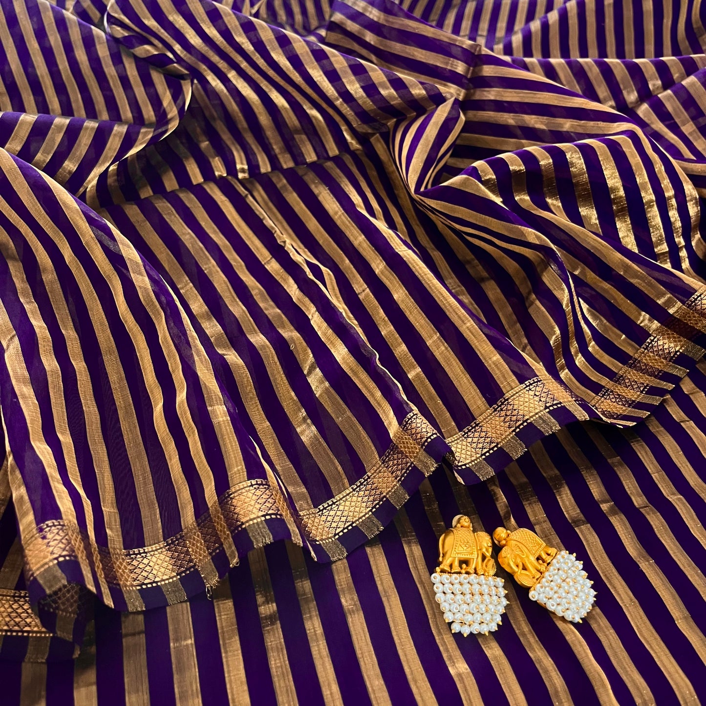 Dark purple and gold Maheshwari saree with zari stripes all over