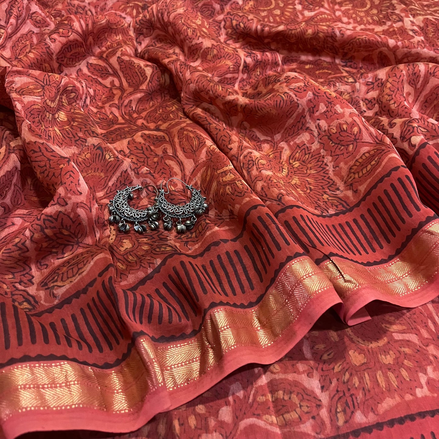 Rust Maheshwari saree with ajrakh print all over