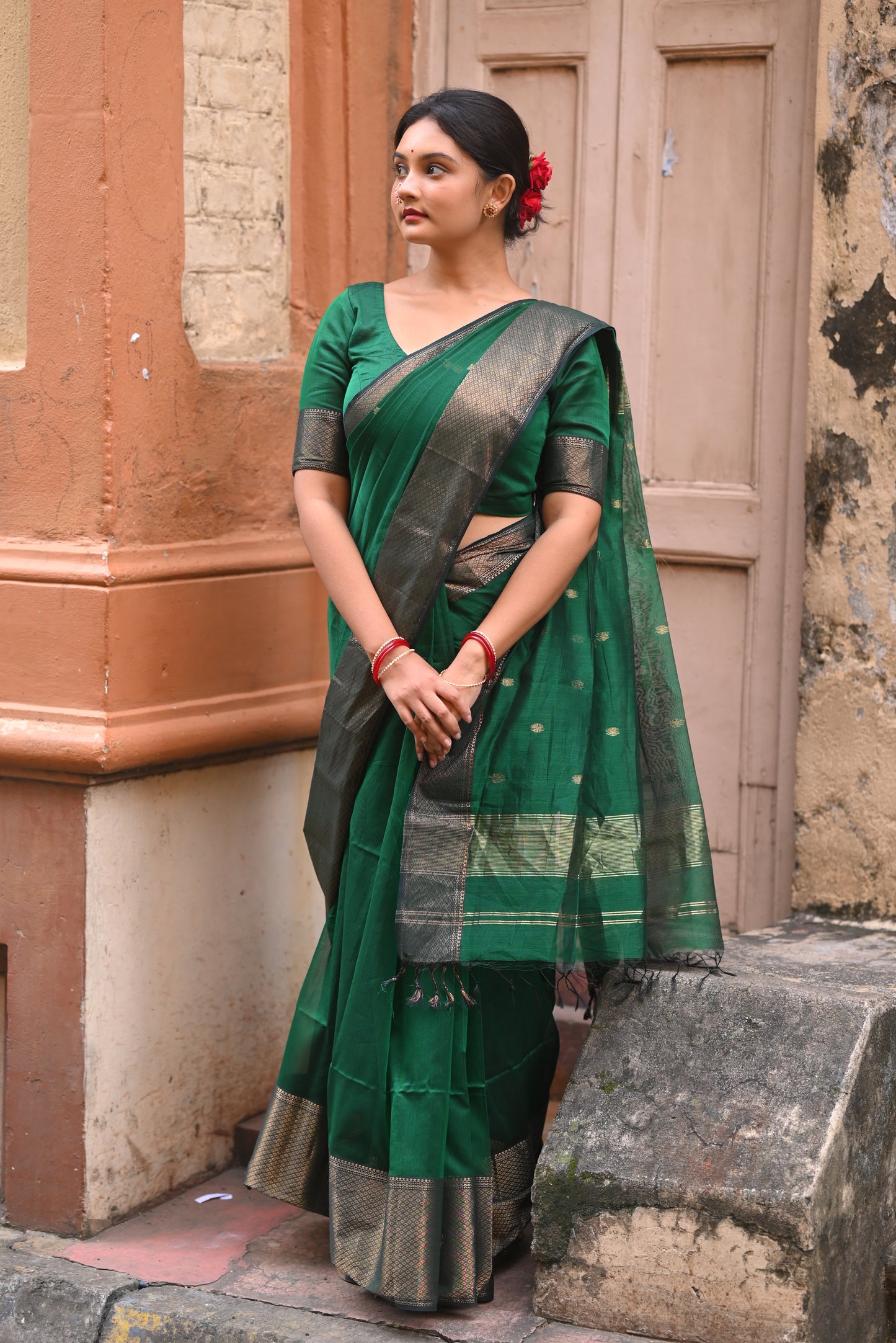 Dark green maheshwari with saree with flower bootis all over