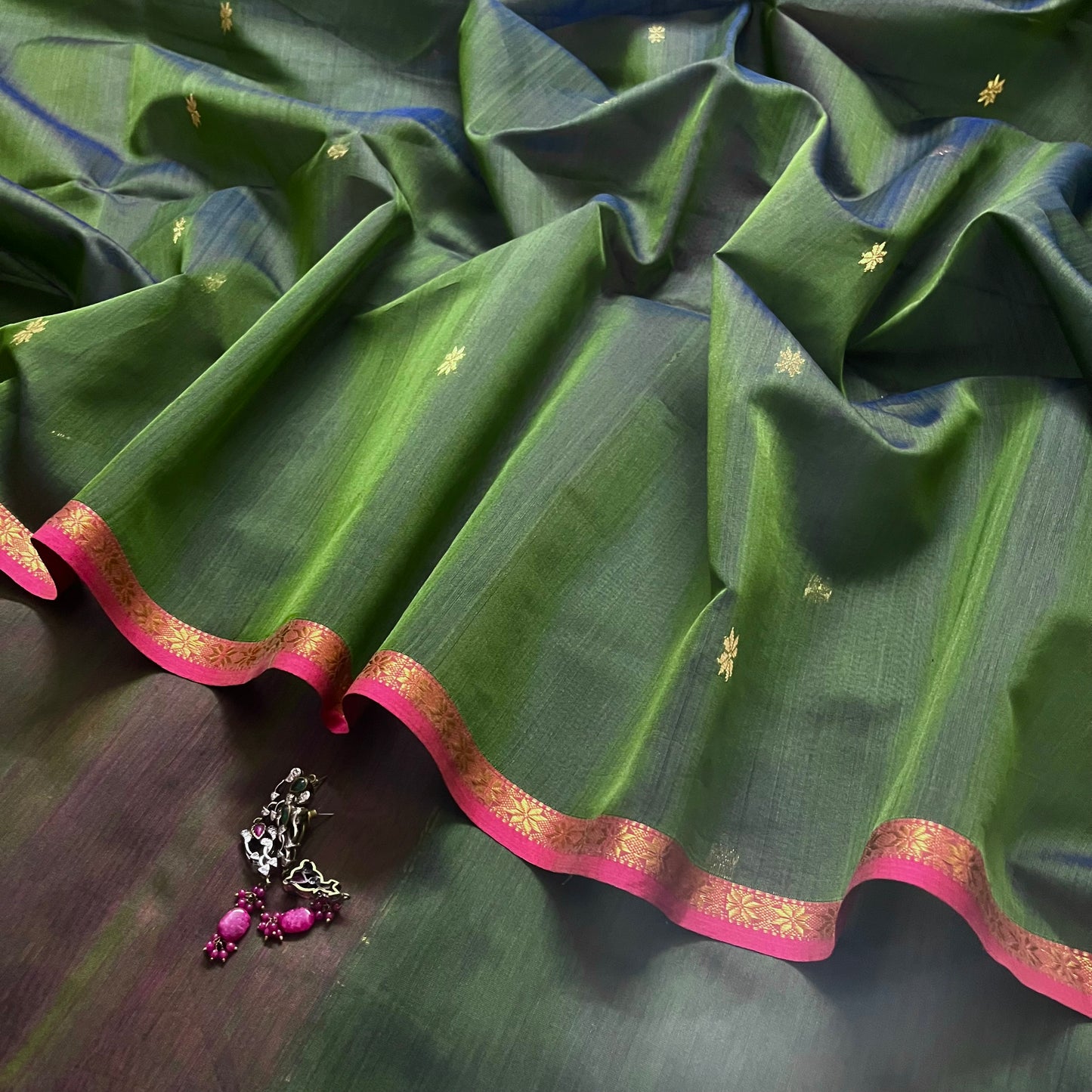 Green and pink Maheshwari saree with flower bootis all over