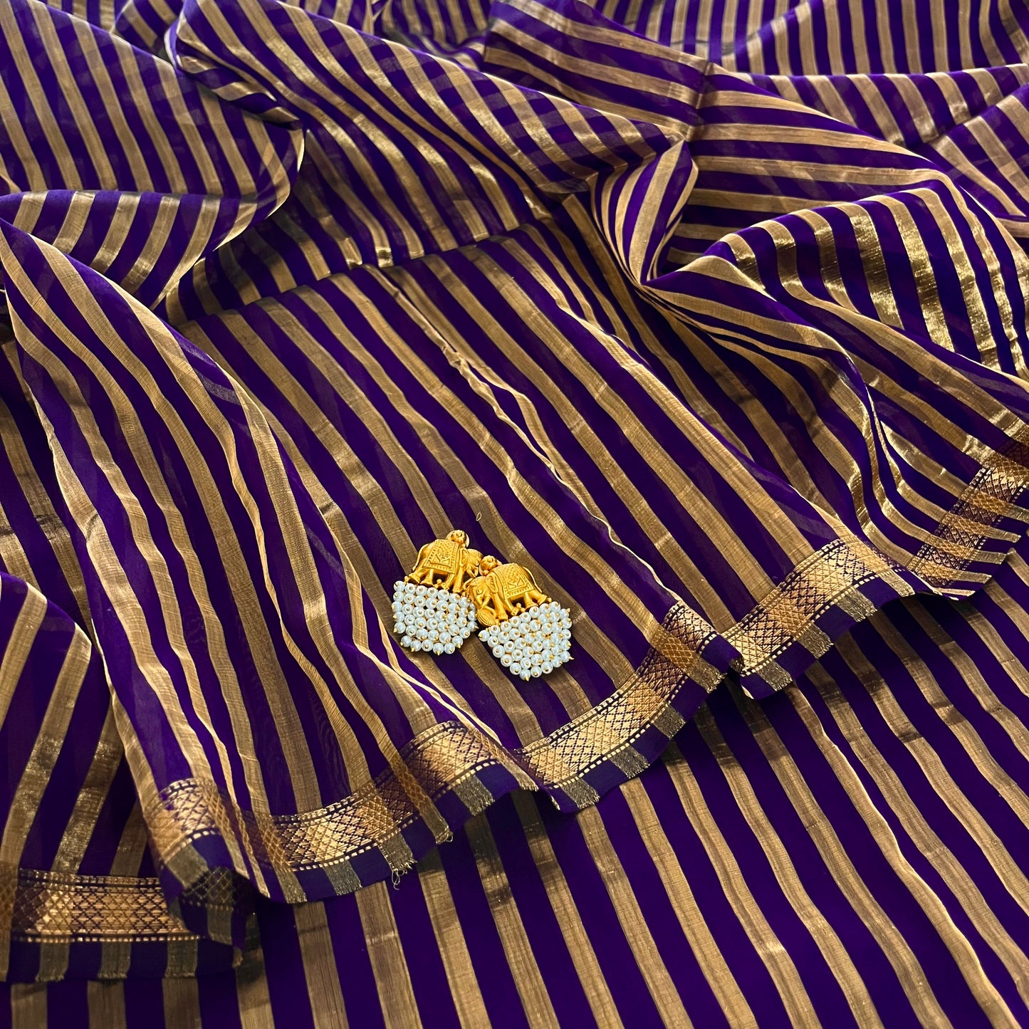 Dark purple and gold Maheshwari saree with zari stripes all over