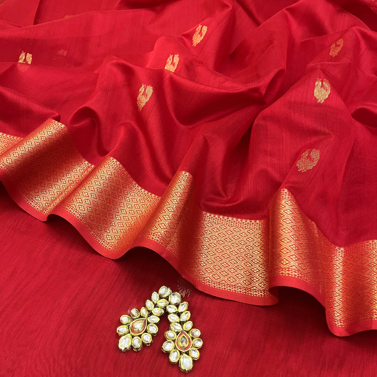 Red Maheshwari saree with morni motifs all over