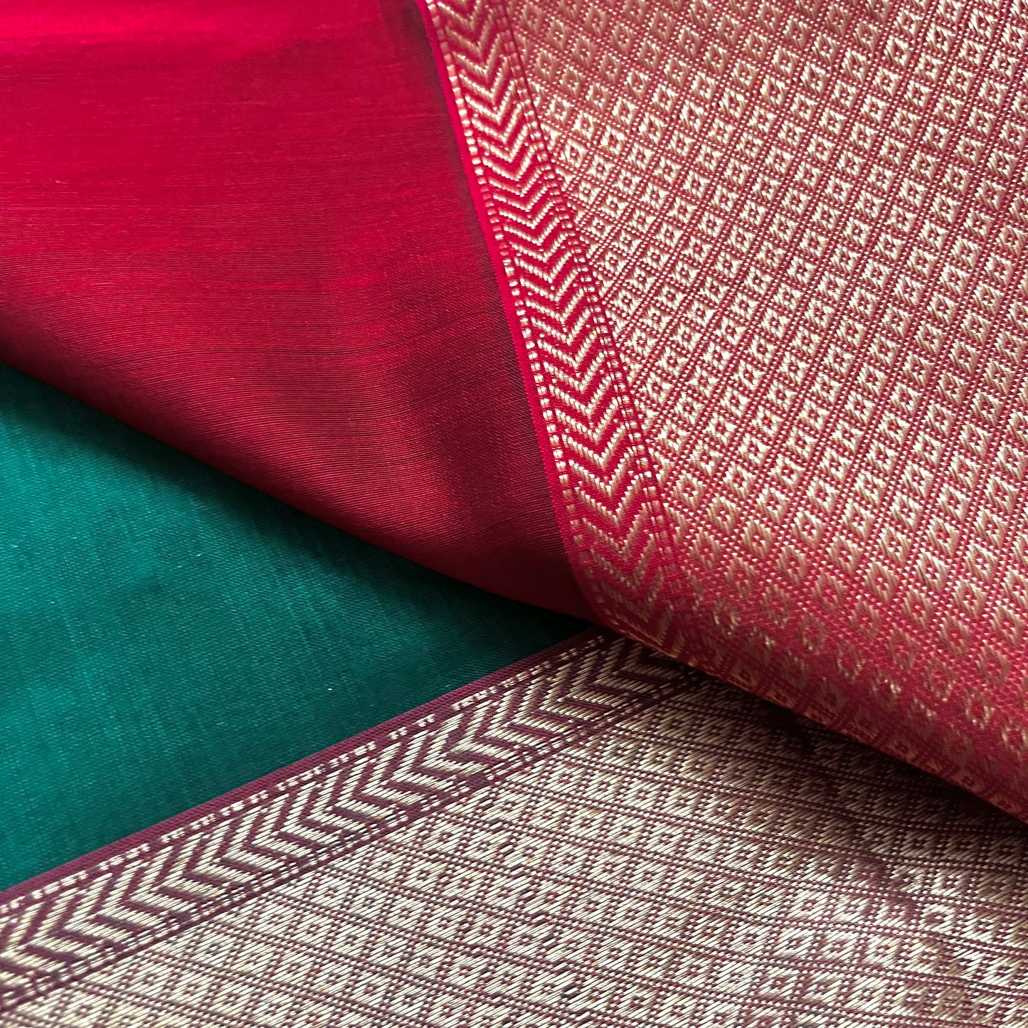 Dark green and red Maheshwari saree with flower motifs all over