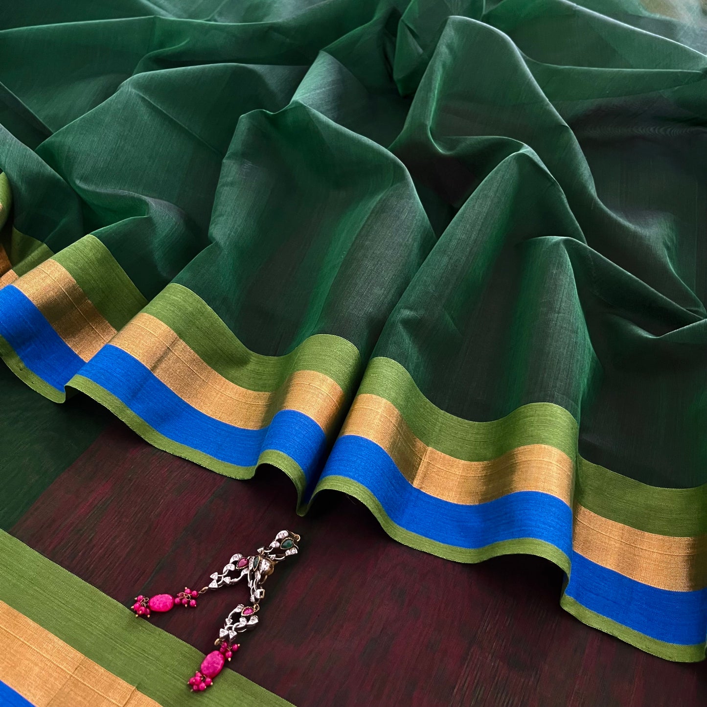 Green and pink Maheshwari saree with zari border