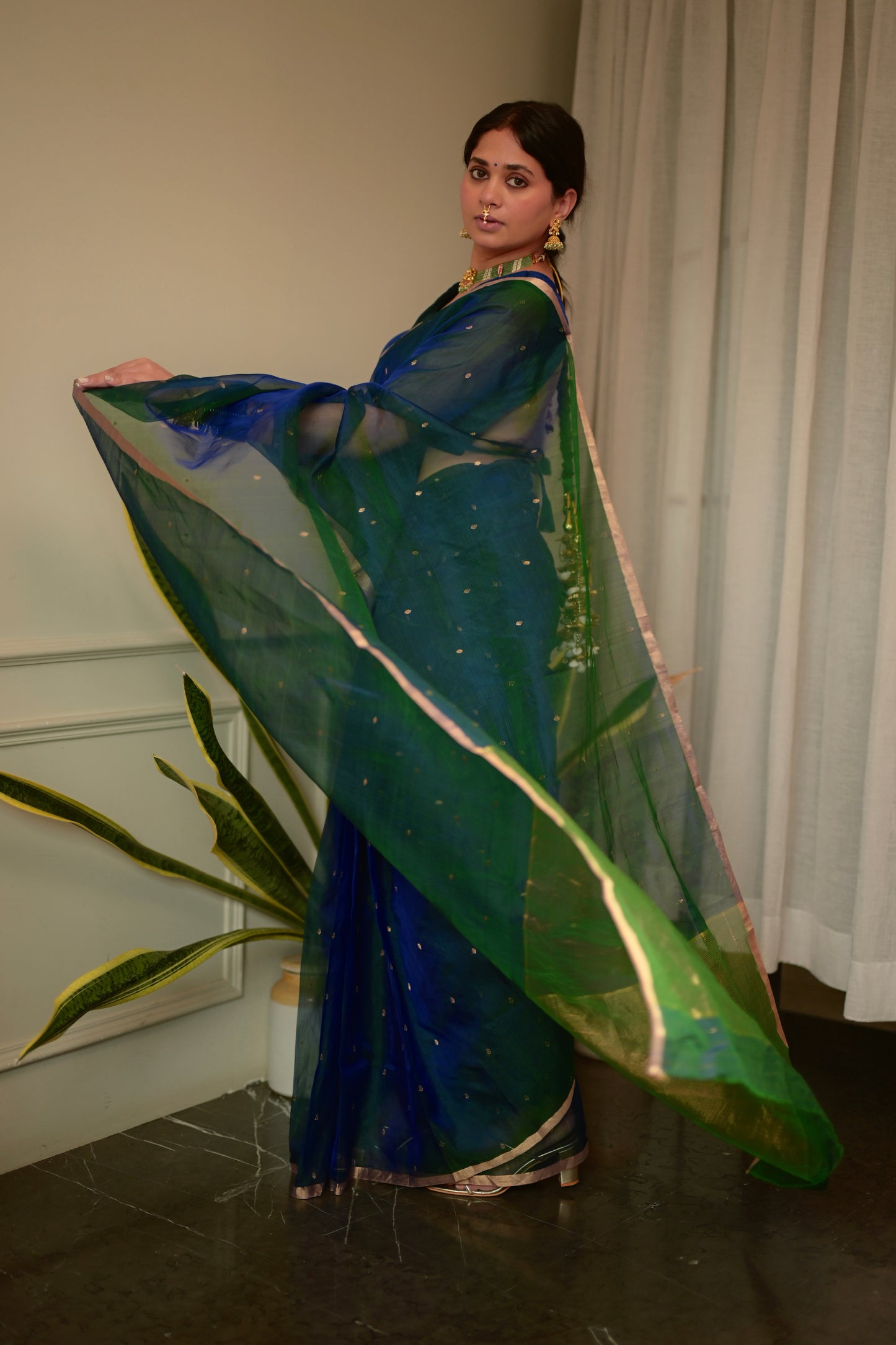 Peacock blue and green dual tone Chanderi organza silk saree with zari bootis all over