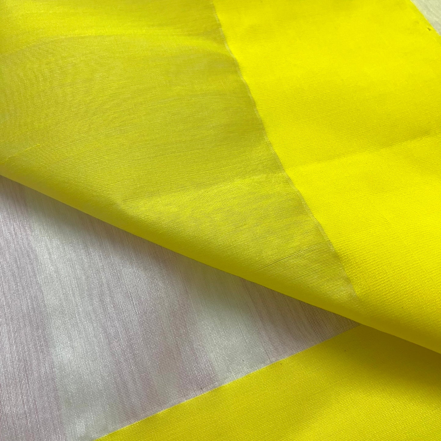 White and lemon Chanderi saree with zari lines on pallu