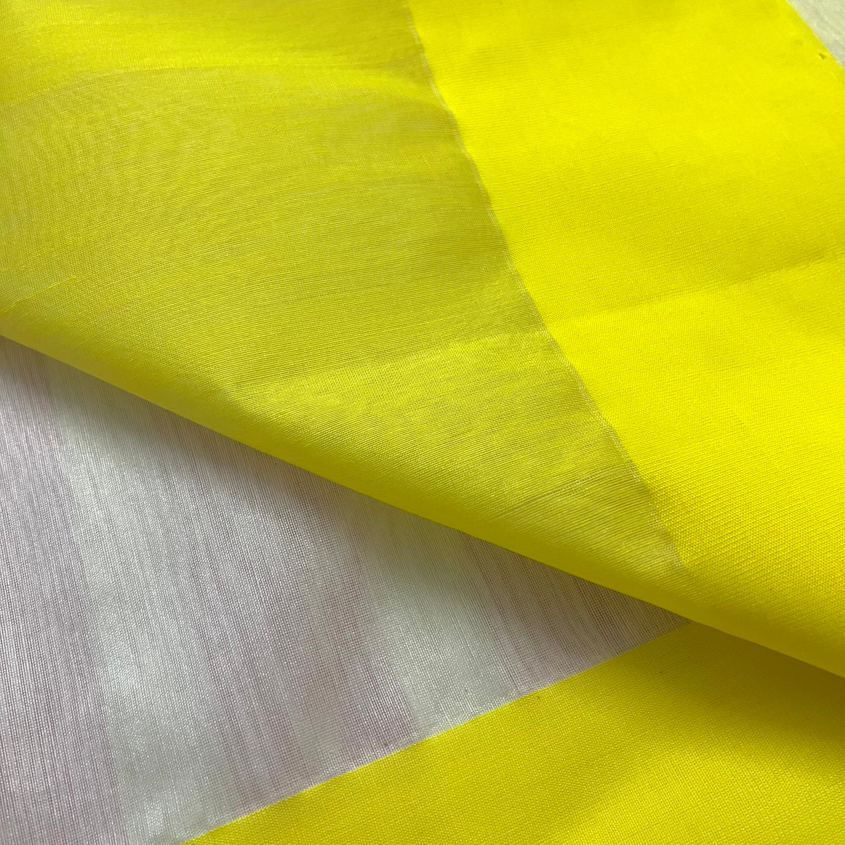 White and lemon Chanderi saree with zari lines on pallu