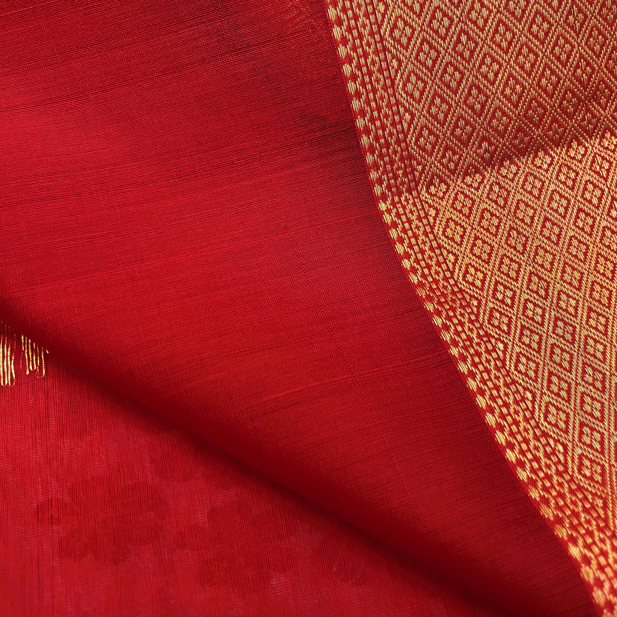 Red Maheshwari saree with morni motifs all over