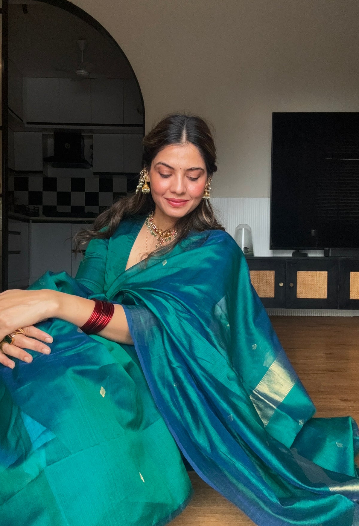 Peacock green and blue dual tone Maheshwari saree with zari bootis all over