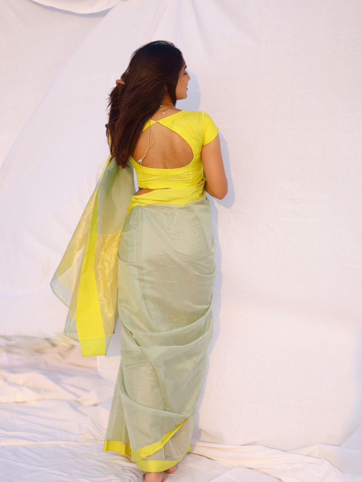 Sage and lemon Chanderi saree with zari lines on pallu