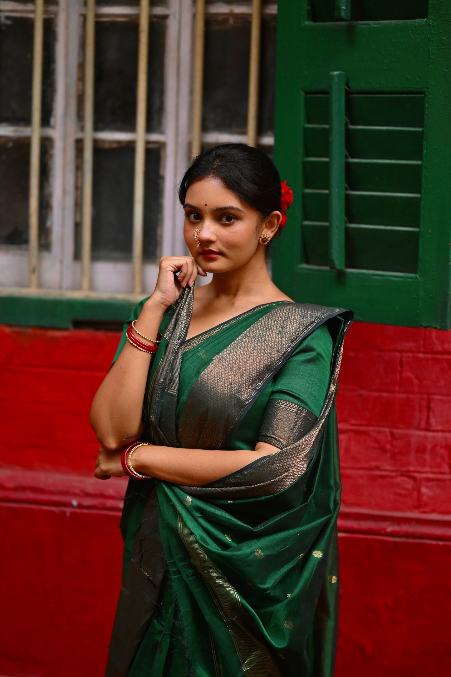 Dark green maheshwari with saree with flower bootis all over