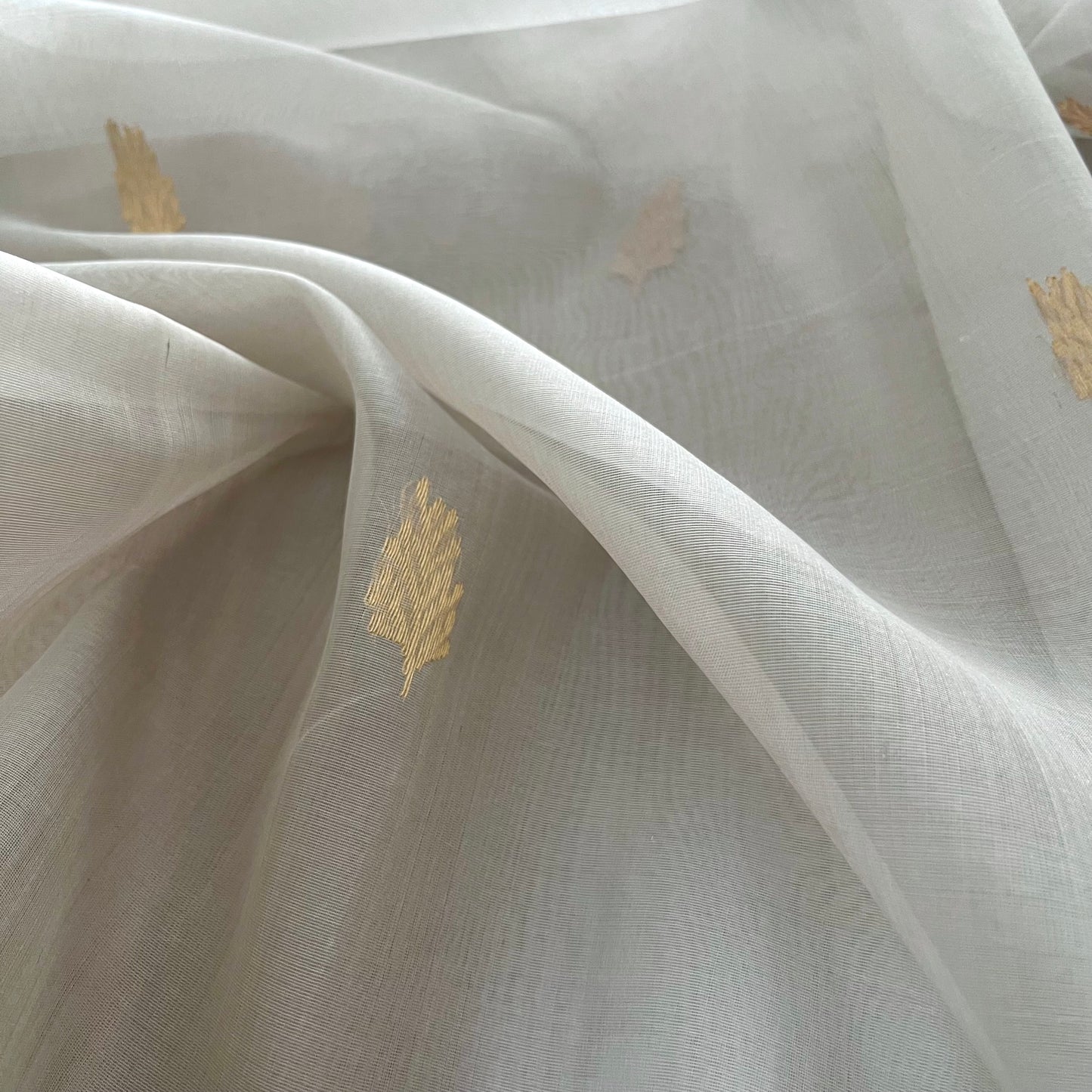 Light grey Chanderi organza silk saree with zari motifs all over