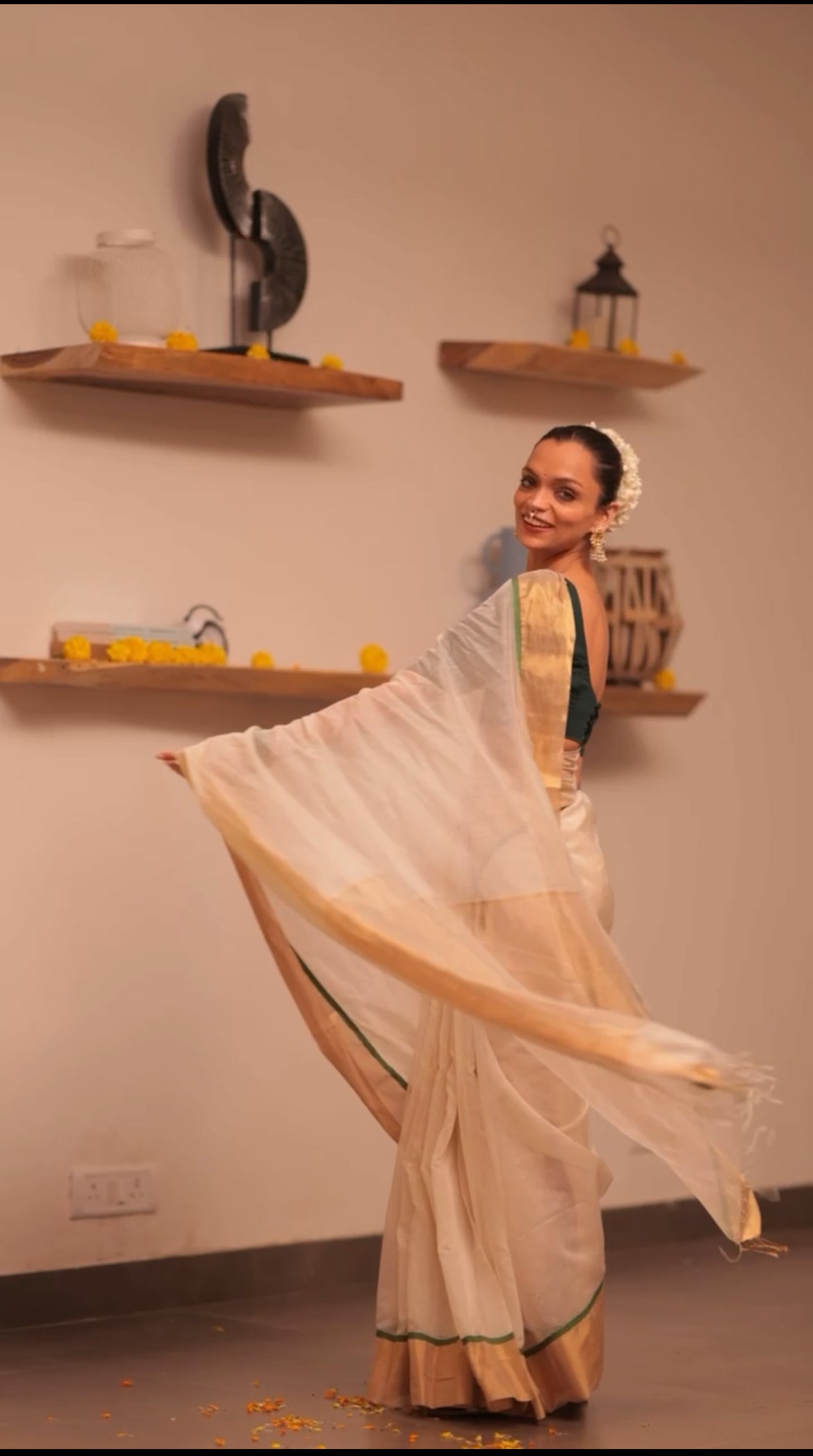 Off white and green maheshwari saree with zari lines on pallu