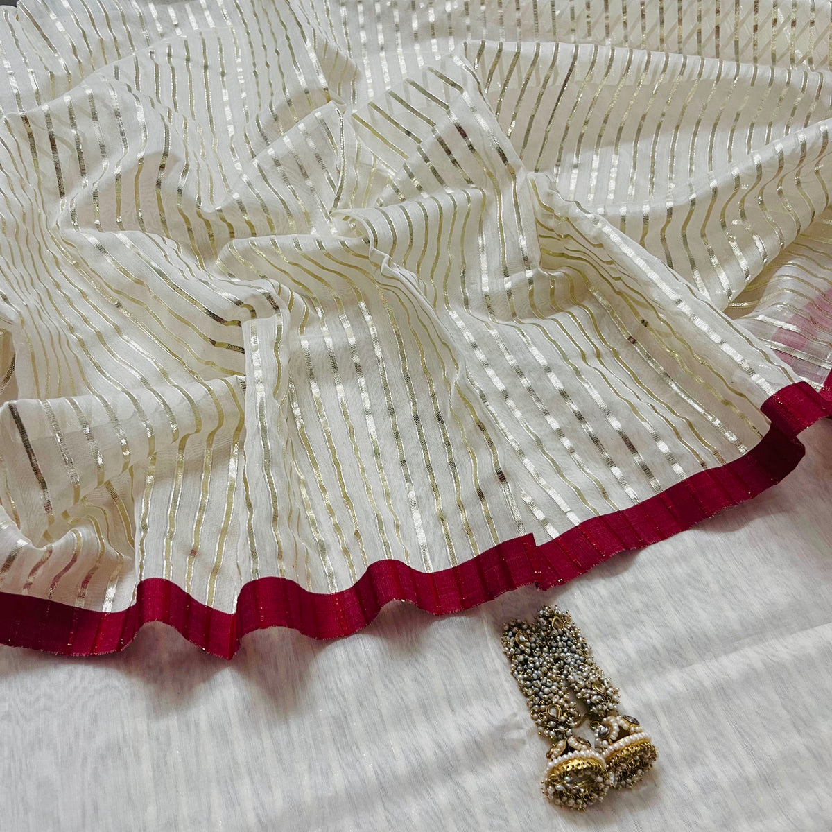Off white & red chanderi saree with intricate gota work all over