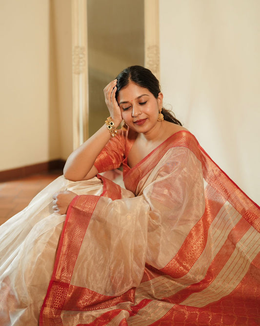 Cream and red Maheshwari tissue silk saree with zari pattern on pallu