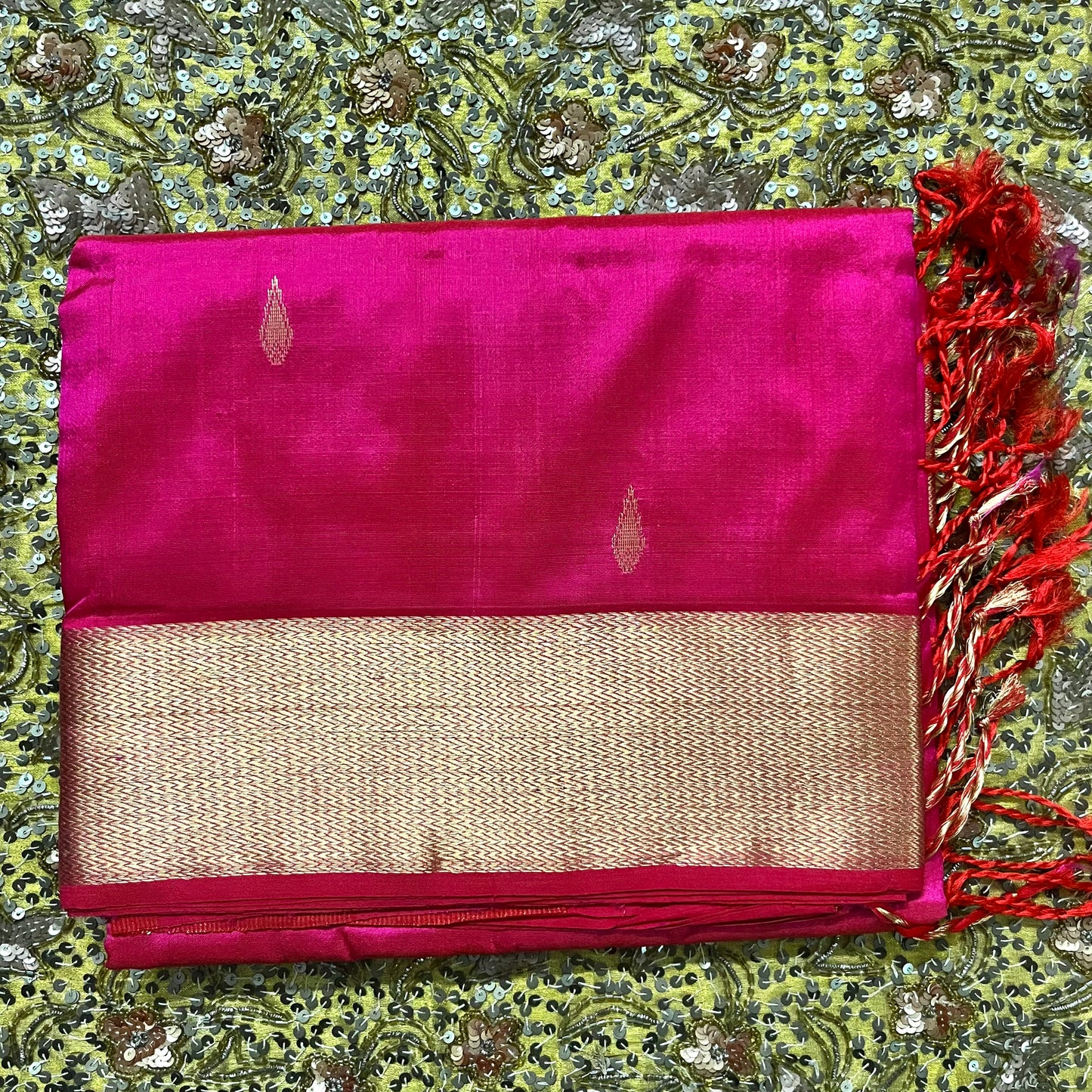 Rani pink Maheshwari silk saree with zari motifs on pallu