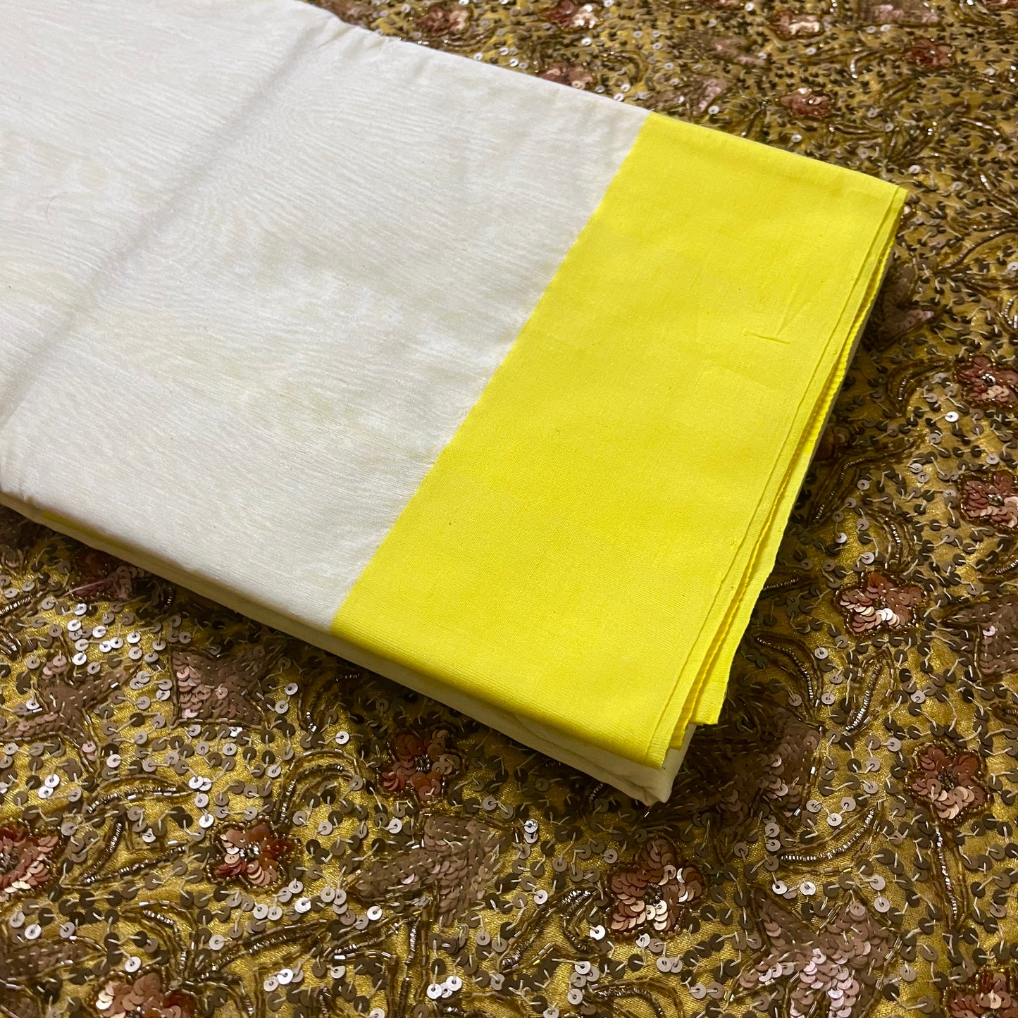 White and lemon Chanderi saree with zari lines on pallu