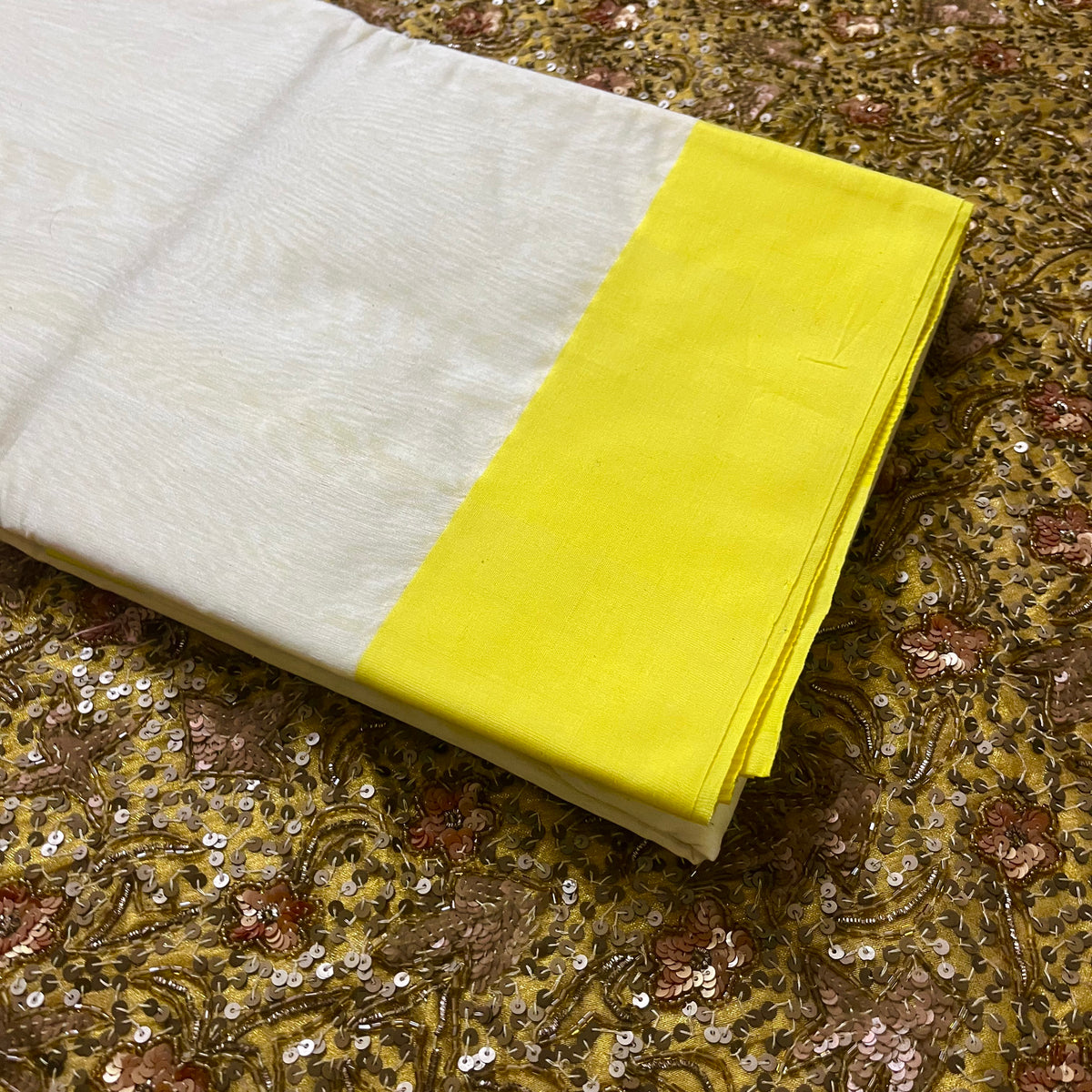 White and lemon Chanderi saree with zari lines on pallu