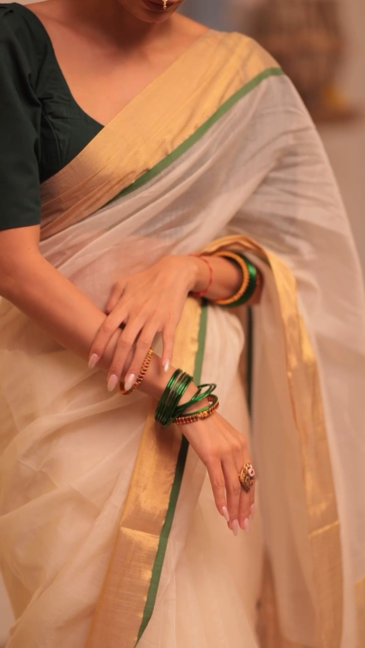 Off white and green maheshwari saree with zari lines on pallu