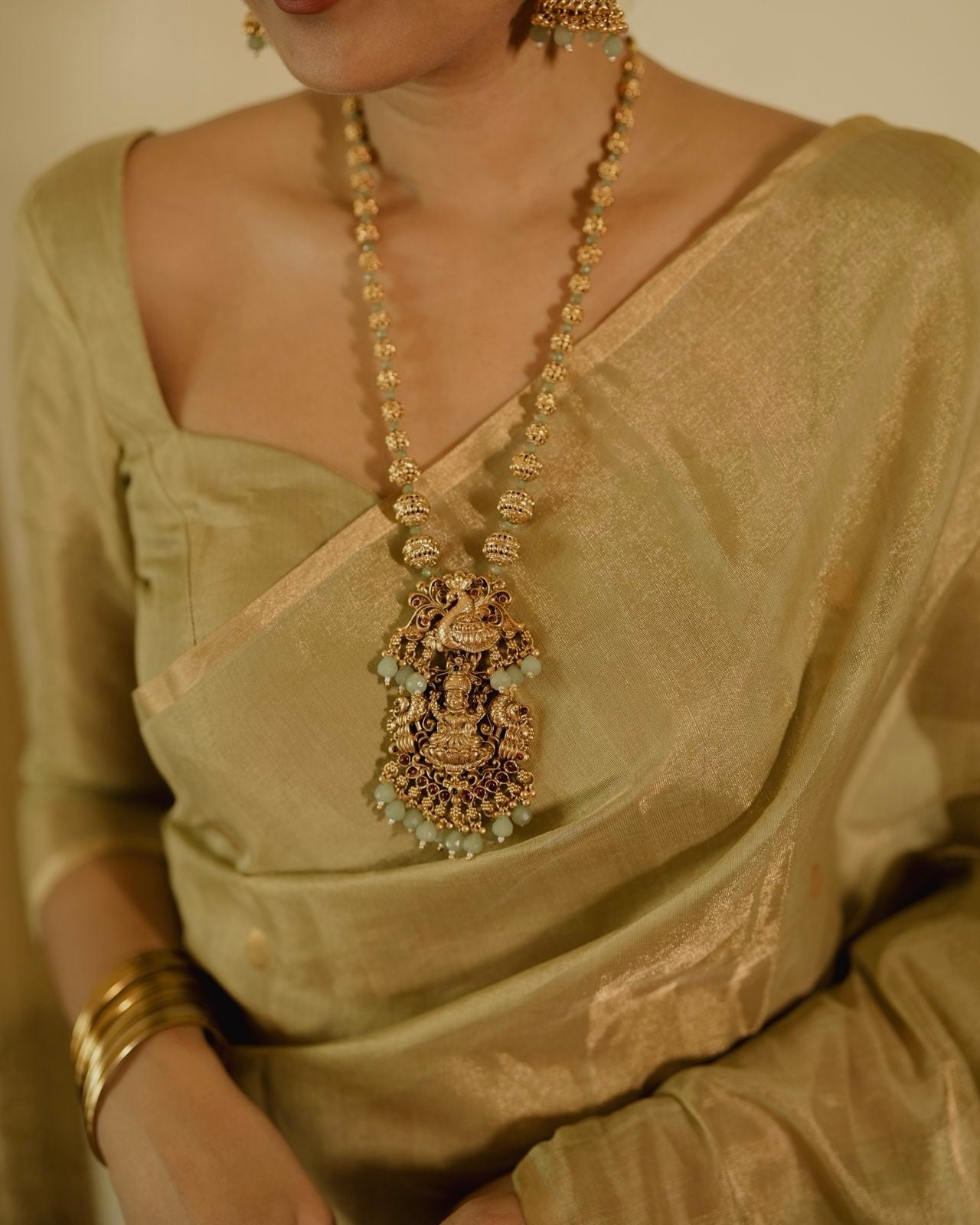Olive gold Maheshwari tissue silk saree with zari bootis all over
