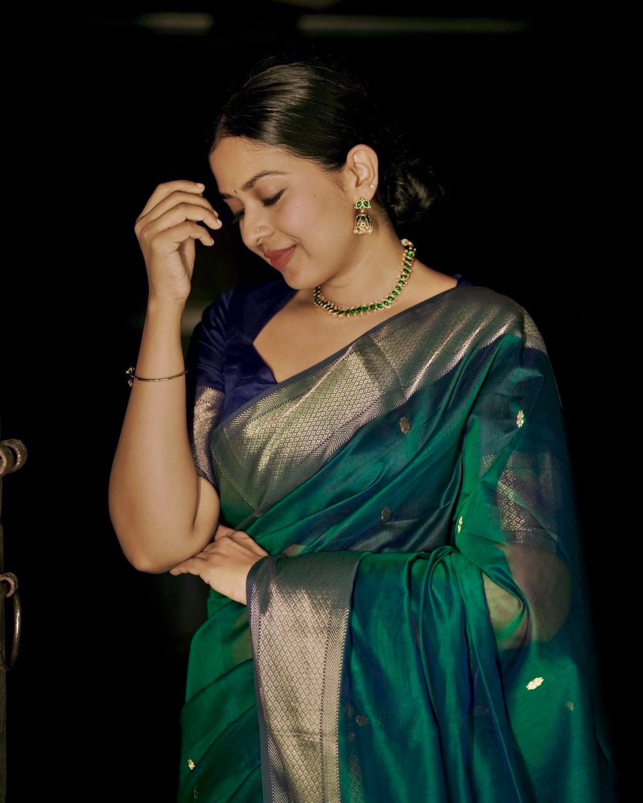 Dark Green and blue maheshwari dual tone saree with flower bootis all over