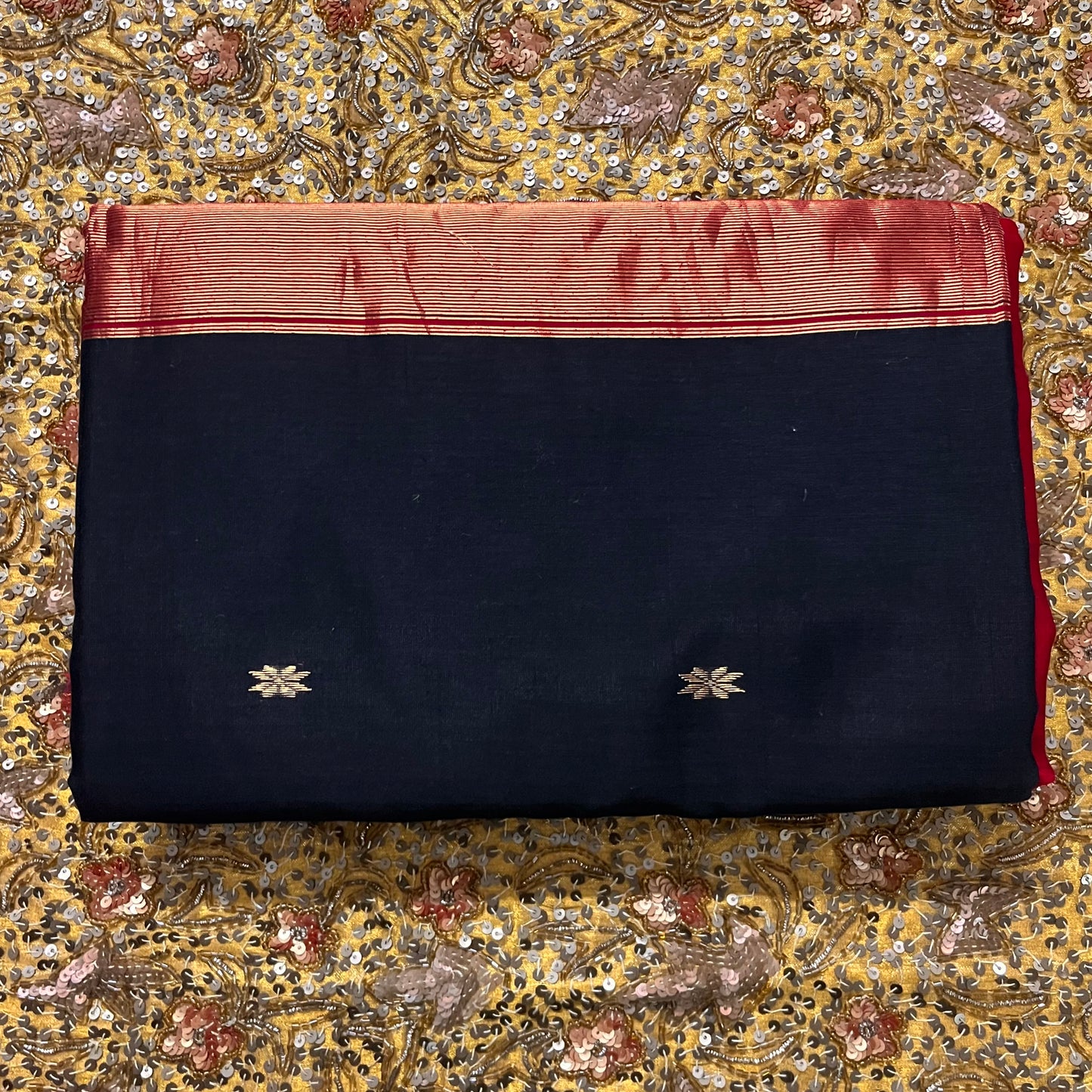 Black and maroon Maheshwari saree with flower bootis all over