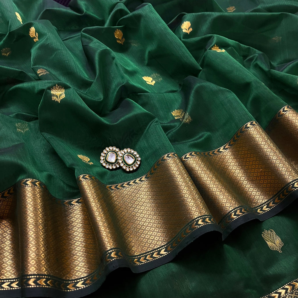 Dark green Maheshwari saree with flower motifs all over