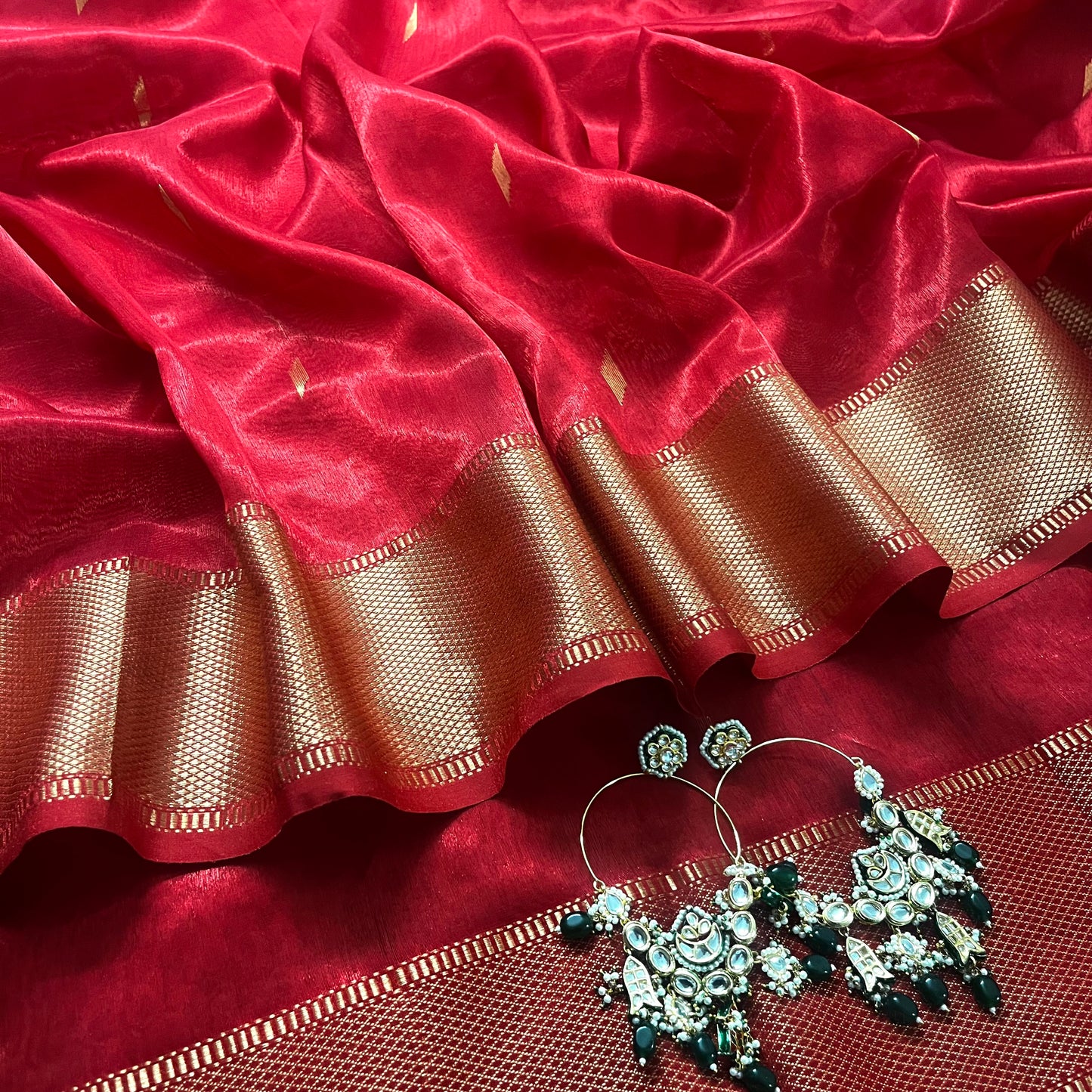 Red Maheshwari tissue silk saree with zari bootis all over