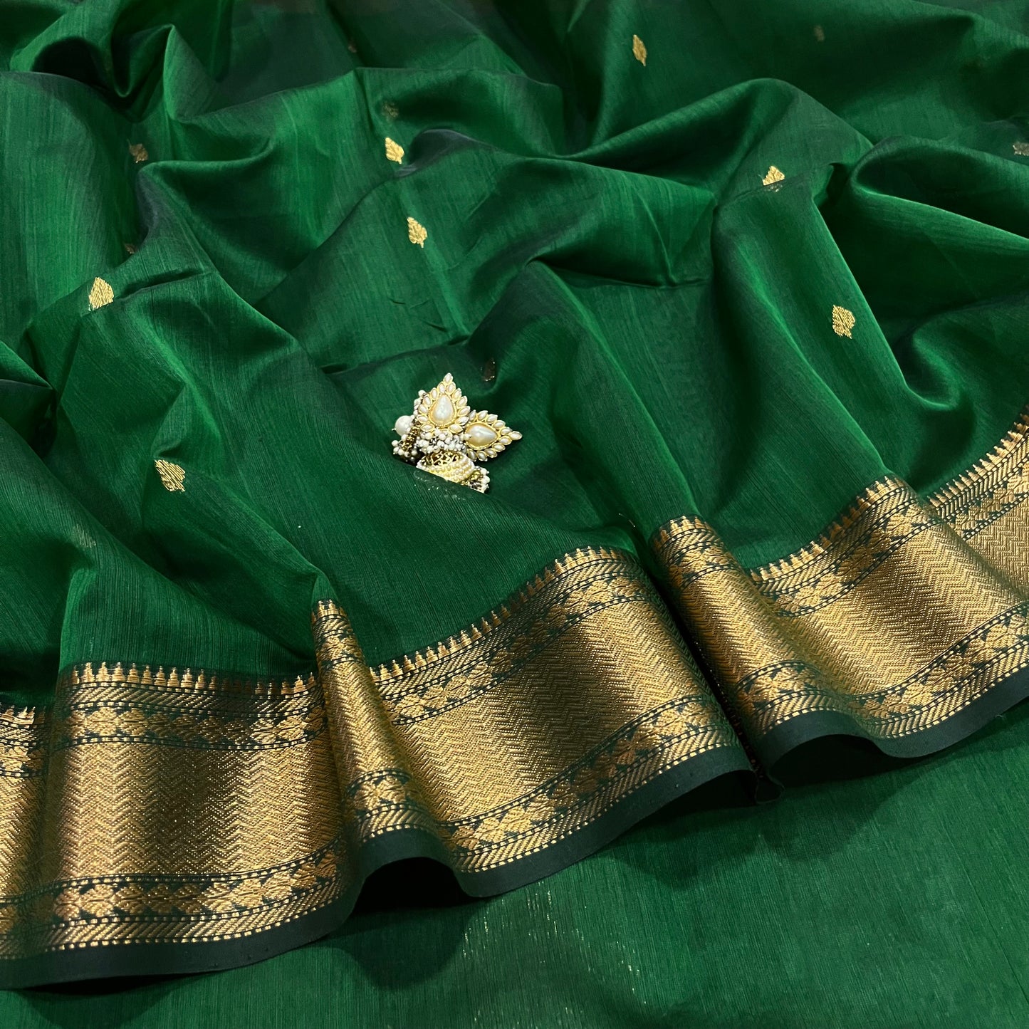 Bottle green Maheshwari saree with zari bootis and zari border
