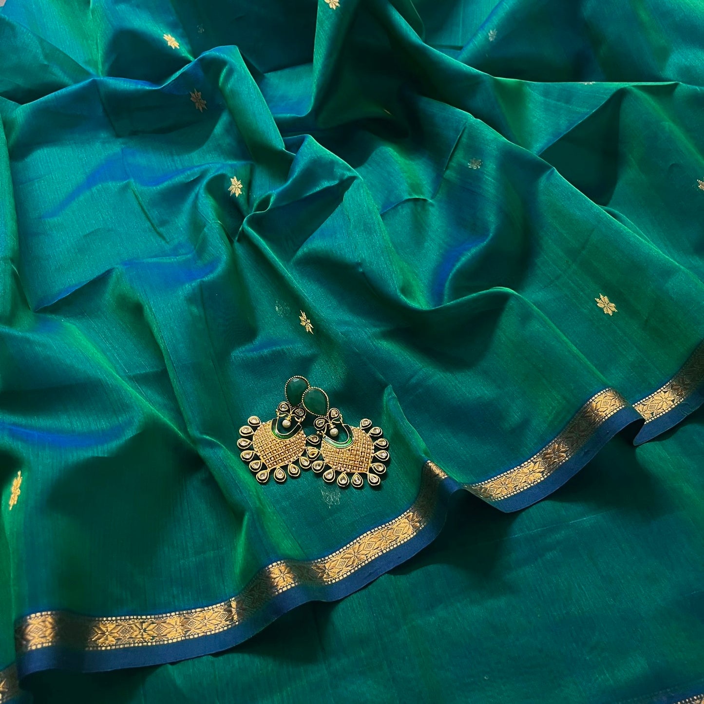 Peacock green and blue Maheshwari saree with zari border and zari bootis all over