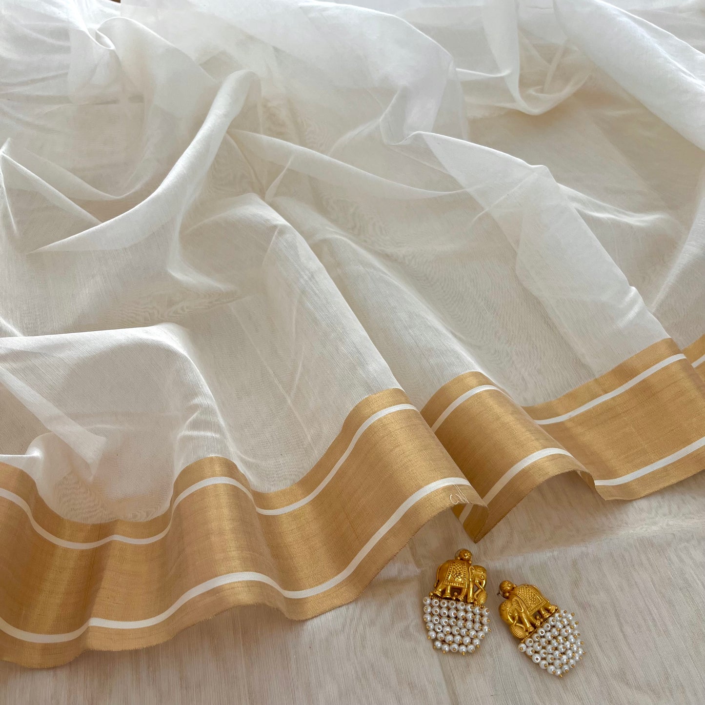 Off white Chanderi saree with zari border
