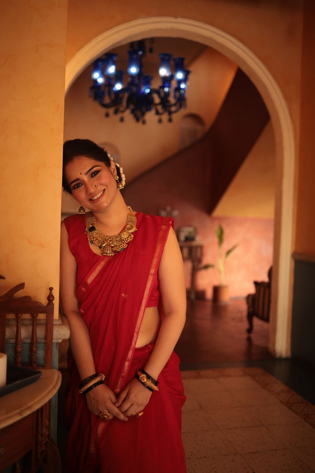 Red maheshwari saree with zari border & zari bootis all over